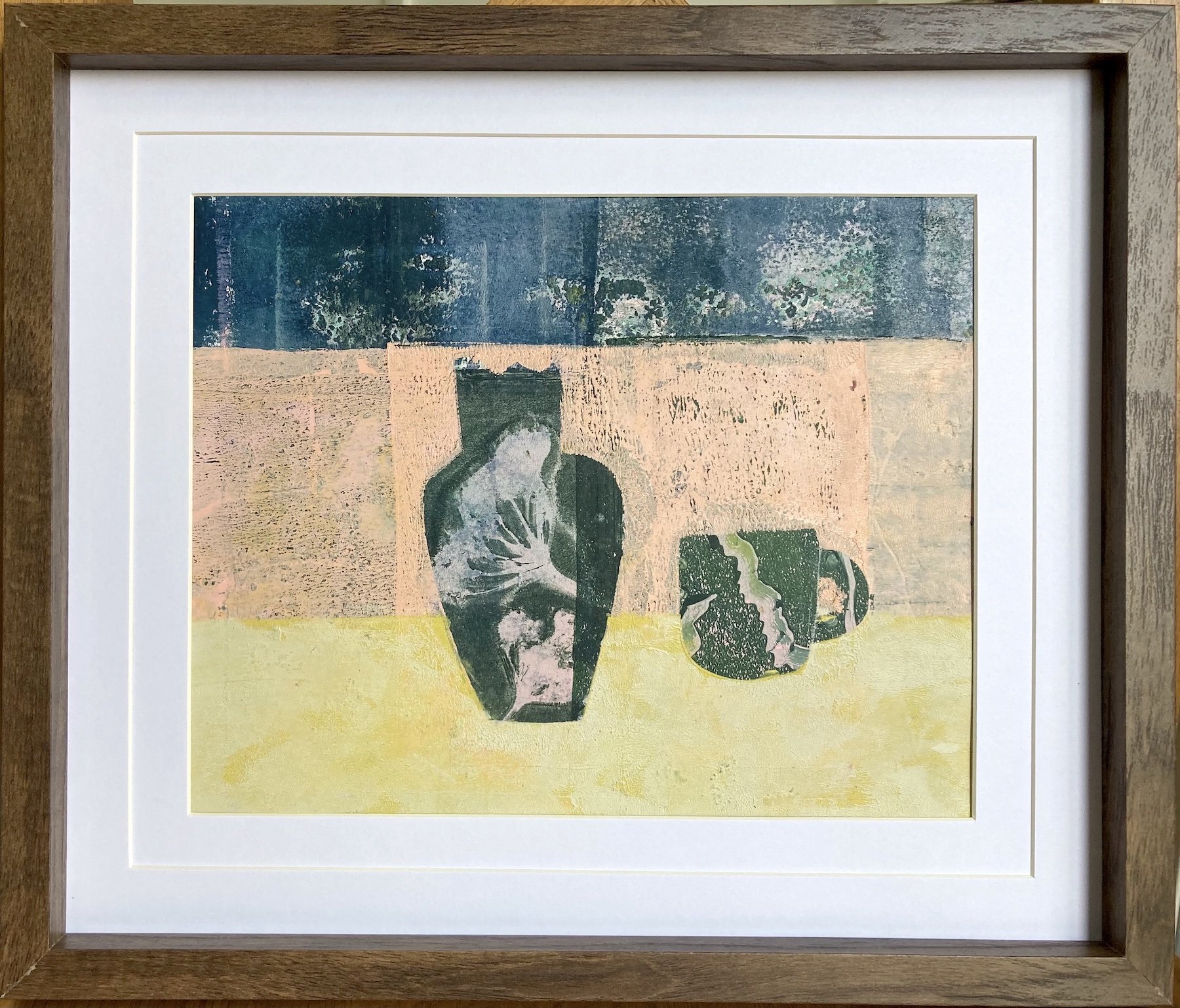 Lucy Mathers' painting called Matching Vase and Mug shown framed in a dark wood frame with double mount.