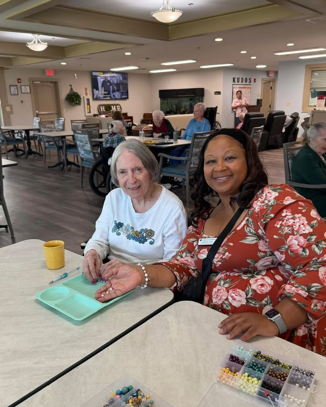 Sandy &amp; Keisha spent the morning crafting with the staff and residents at the Oaks at Hampton! A little creativity, a lot of beads, and some fun new pens! 🩷🖊️✨ #CaritasHospice #HospiceVolunteers