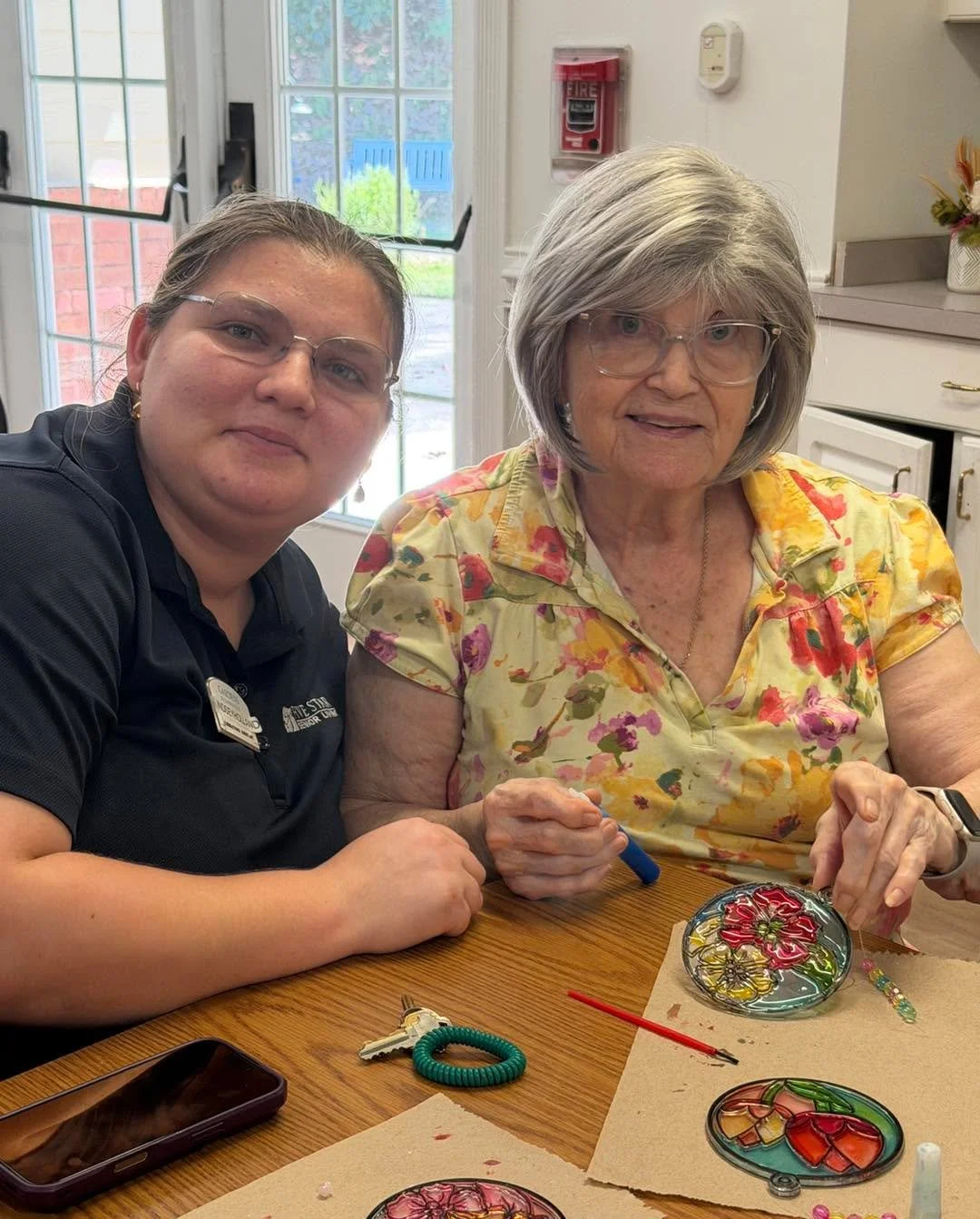 Sandy &amp; Keisha were catching a little sunshine and creating something beautiful with our friends at the Gardens of Gainesville this afternoon! ☀️ Our suncatcher painting was full of color, creativity, and smiles. 💕🌈 #CaritasHospice #HospiceVolu