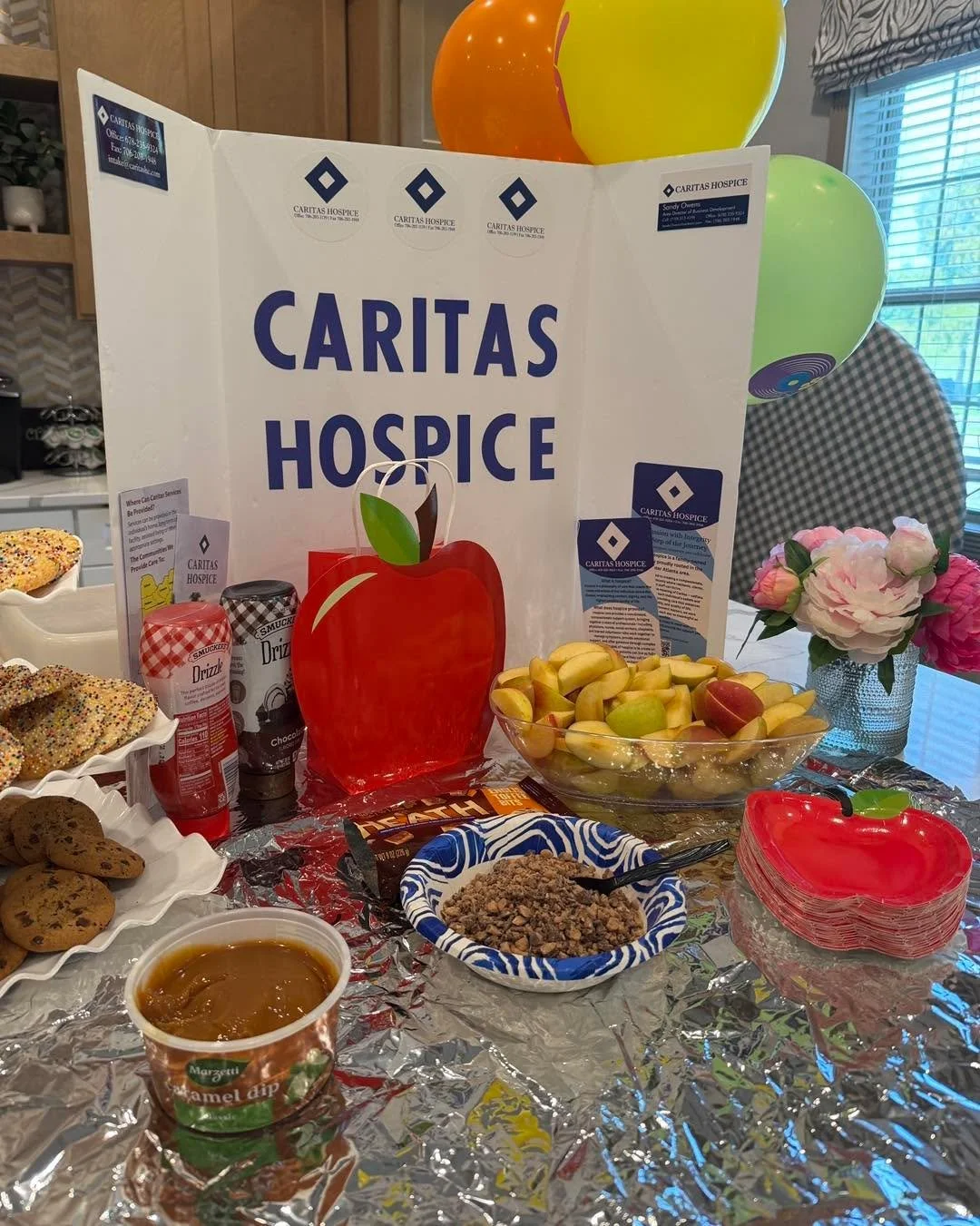 An apple-solutely delicious way to celebrate Assisted Living Week with our friends at the Oaks at Gracemont! 🍎💕 Our apple bar was a sweet treat for staff and residents, with plenty of toppings to make the perfect snack. 🍏🎉 #CaritasHospice #Assist