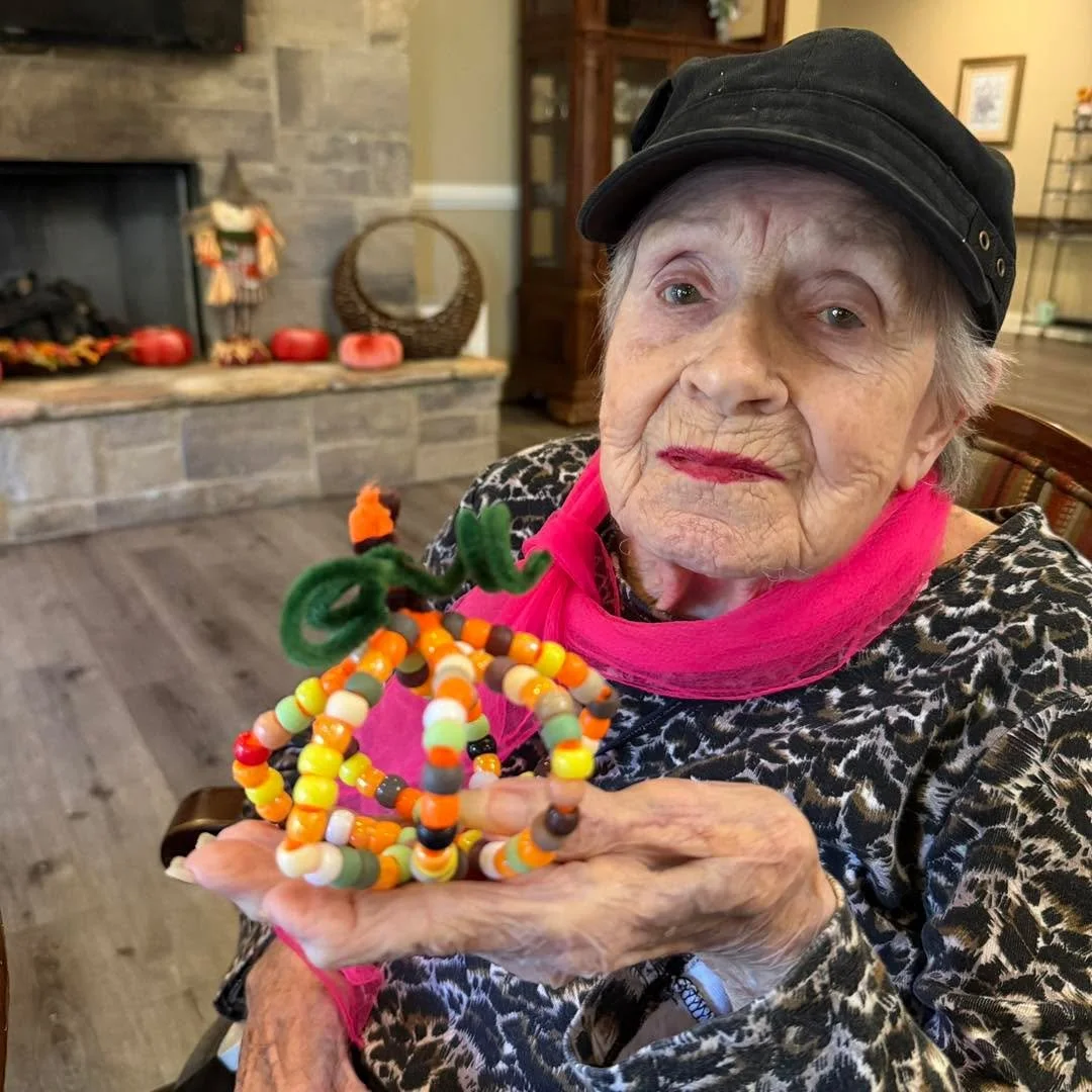 Tiny beads, big smiles! 😊 Our beaded pumpkin craft was the perfect way to celebrate the season with our friends at North Georgia Assisted Living! 🎃🧡💚🤎 #CaritasHospice #HospiceVolunteers