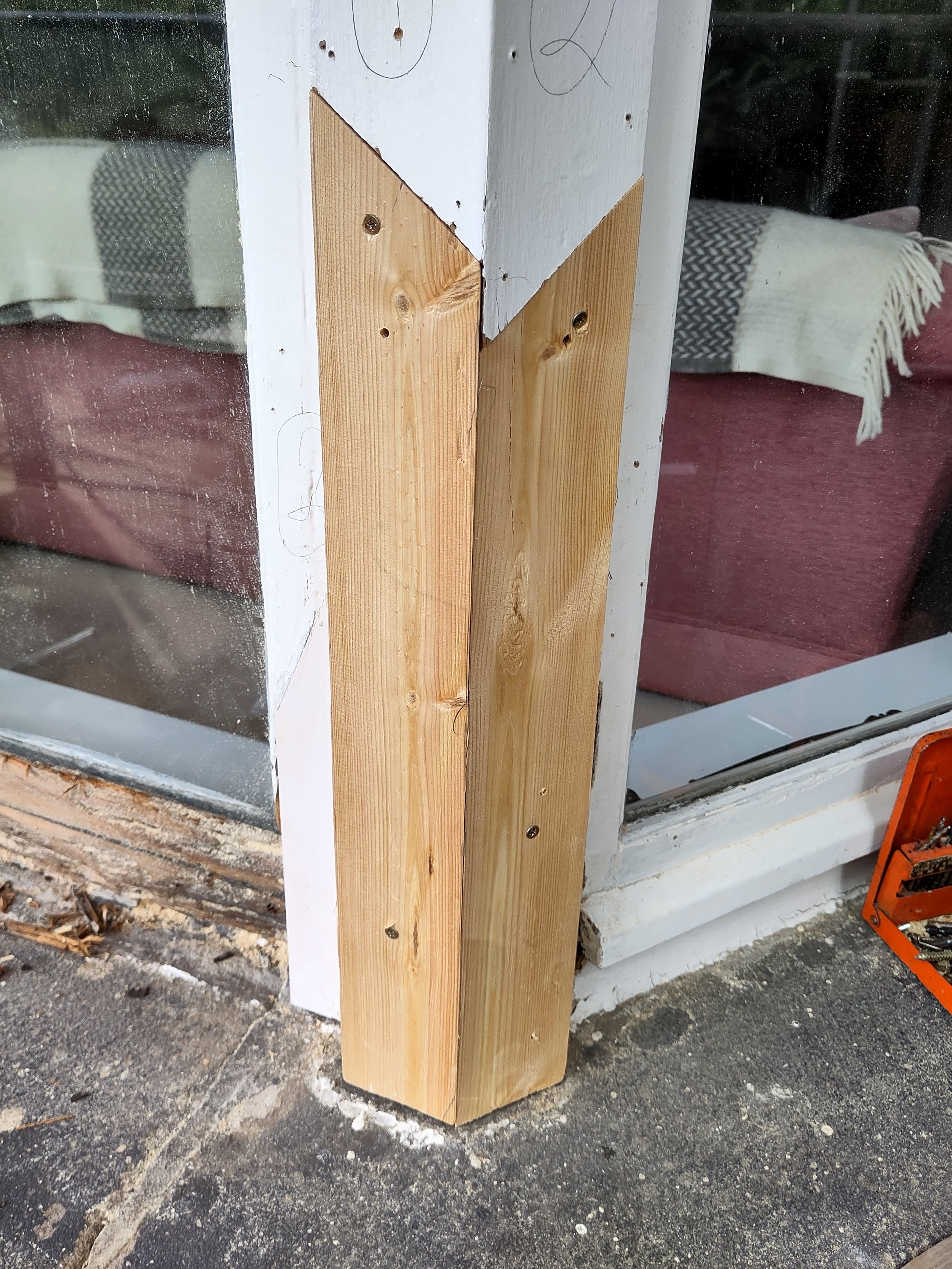 Corner of a bay window after restoration, showing new timber sections spliced in for a private client.
