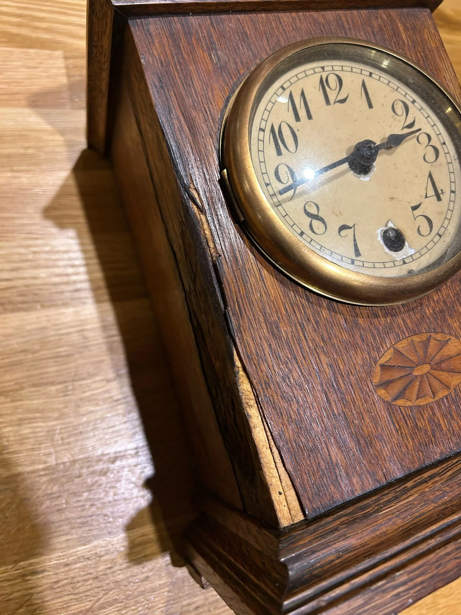 A fire‑damaged mantel clock submitted as part of an insurance claim.