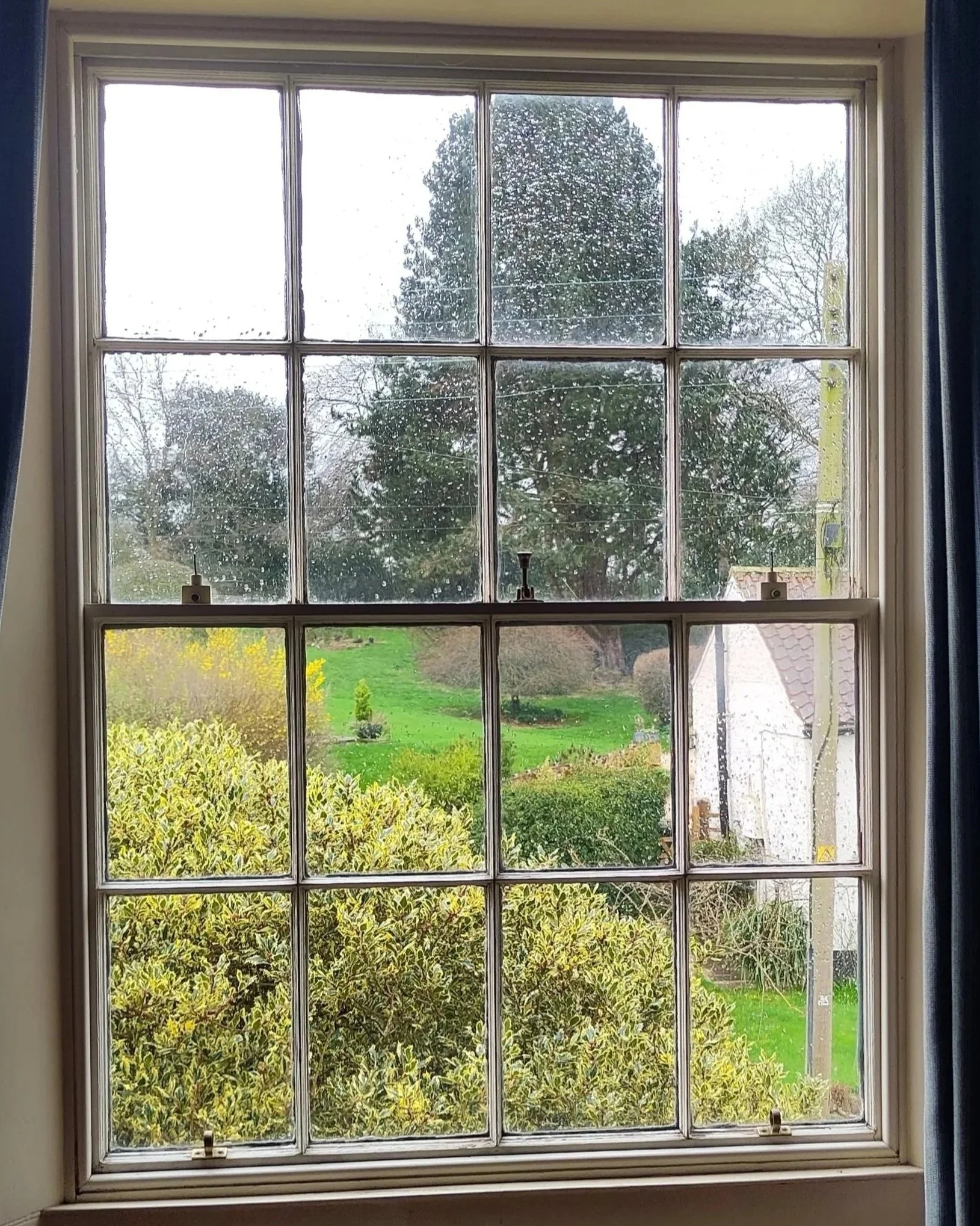 Boxed‑frame sliding sash window showing traditional joinery construction from 1800.