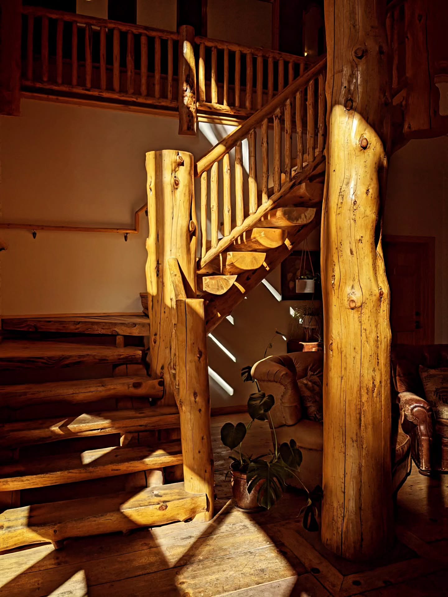 Moody staircase vibes... Fun fact, the logs were hand stripped on location and have more than just an aesthetic appeal - they are structural to the building.