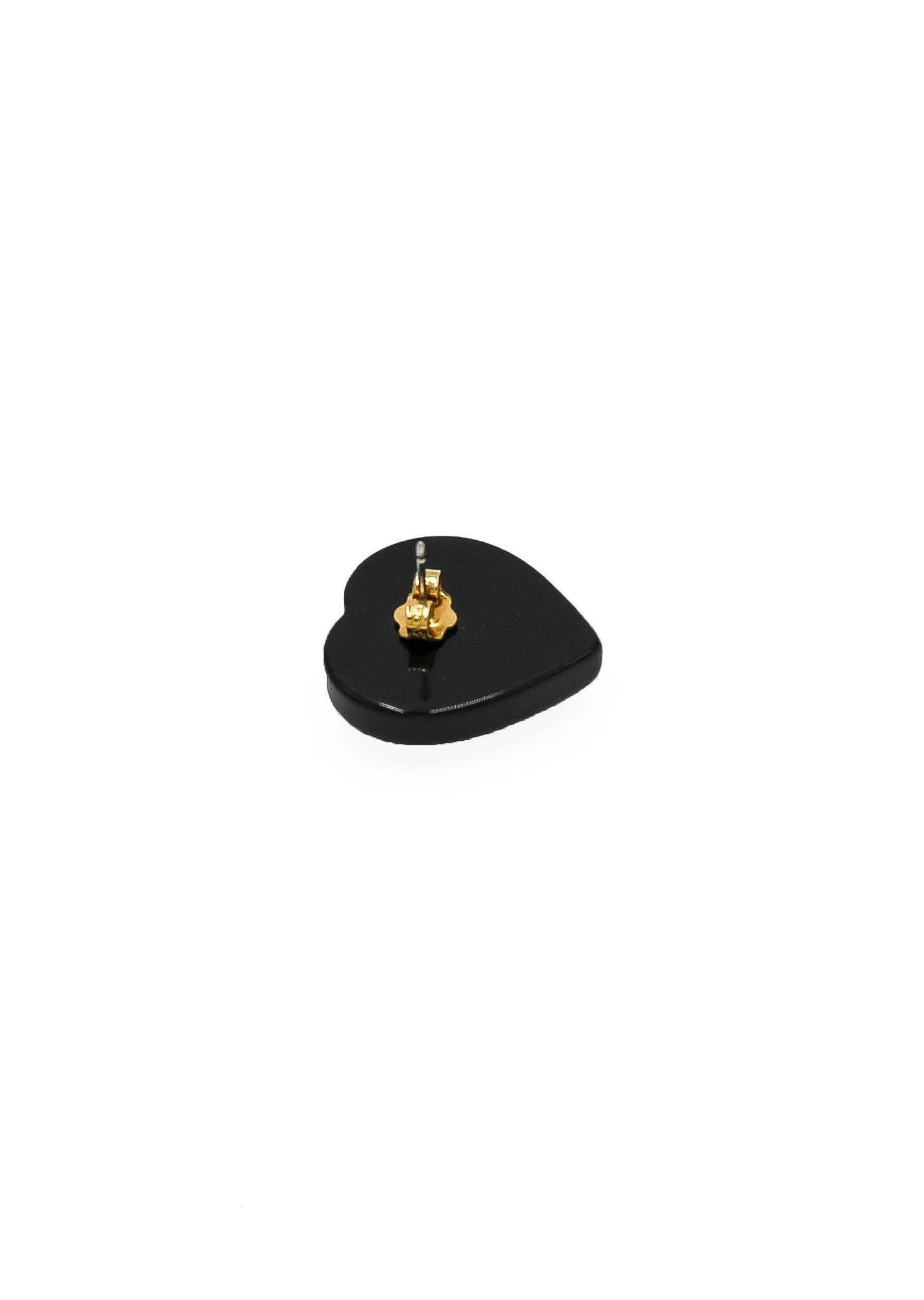 vintage shop - collector of vision black and white heart shaped stud earrings showing the side with gold plated metal studs
