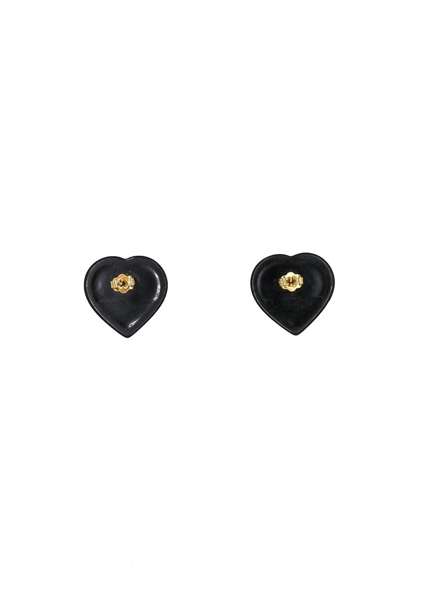 vintage shop - collector of vision black and white heart shaped stud earrings showing the back side with gold plated metal studs