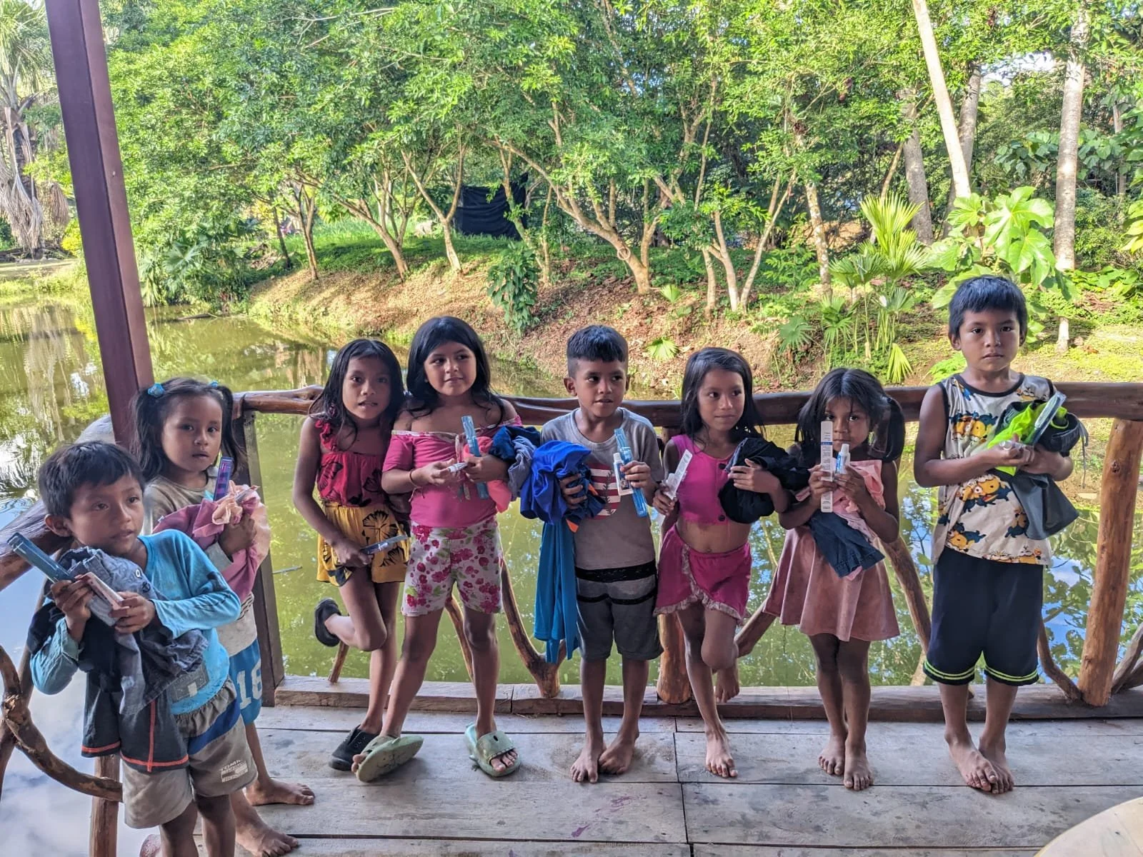 ECUADOR - Giving out toothbrushes clothes to kids in Misahualli Bob and Tami.jpg