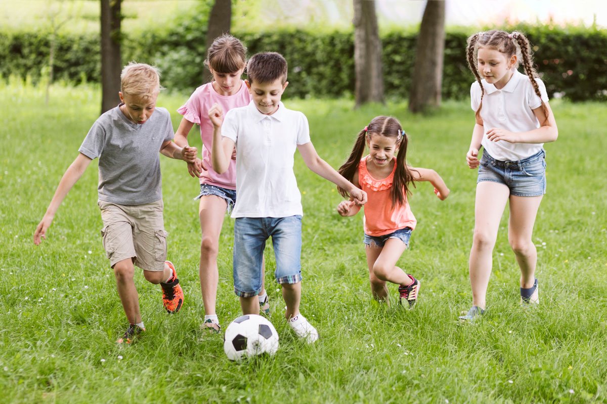 children-playing-football-outside_Kids-friends-photo-created-by-freepik.jpg