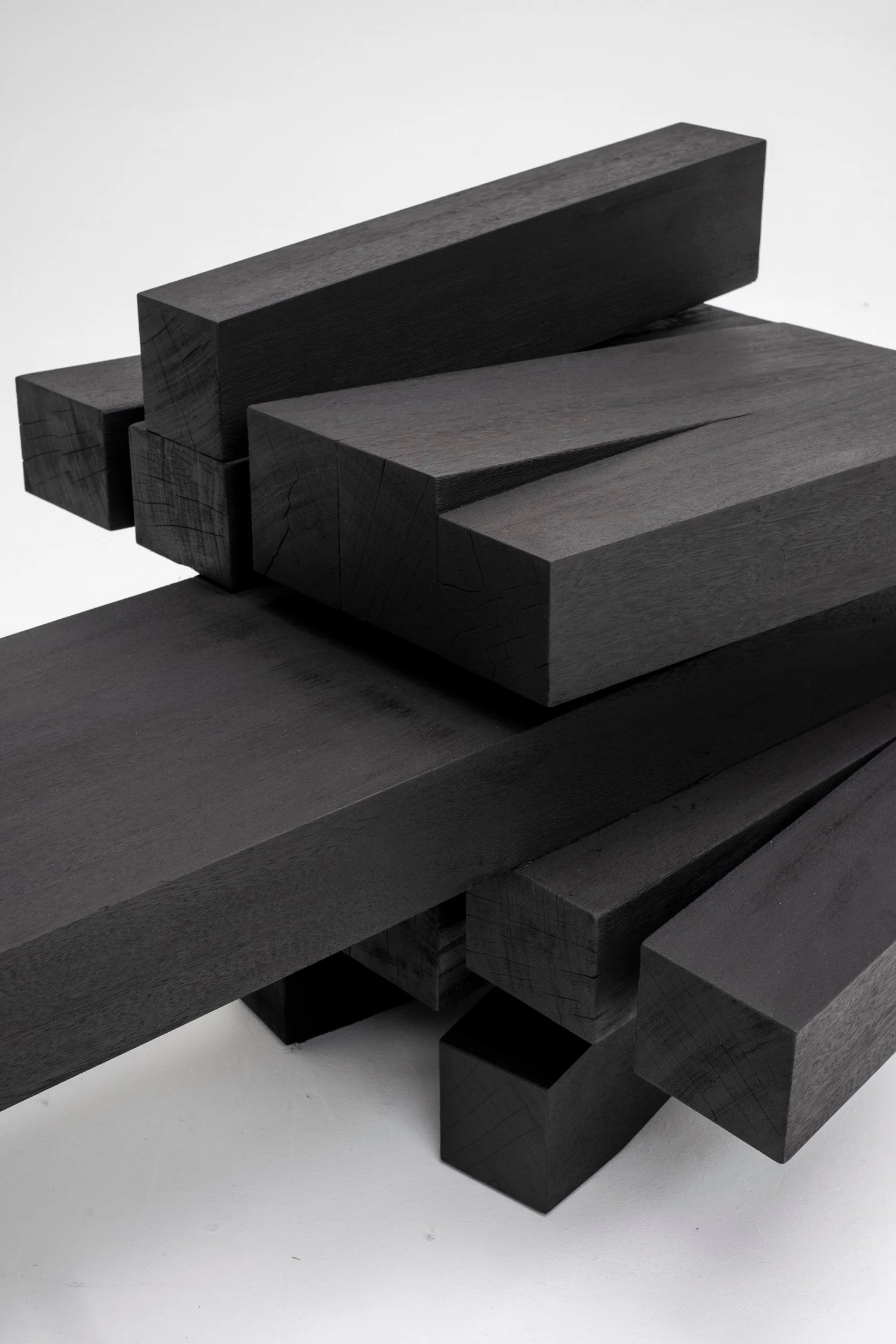 Detail of burned and oiled Iroko wood in Zoumey Bench 012024 by Arno Declercq.