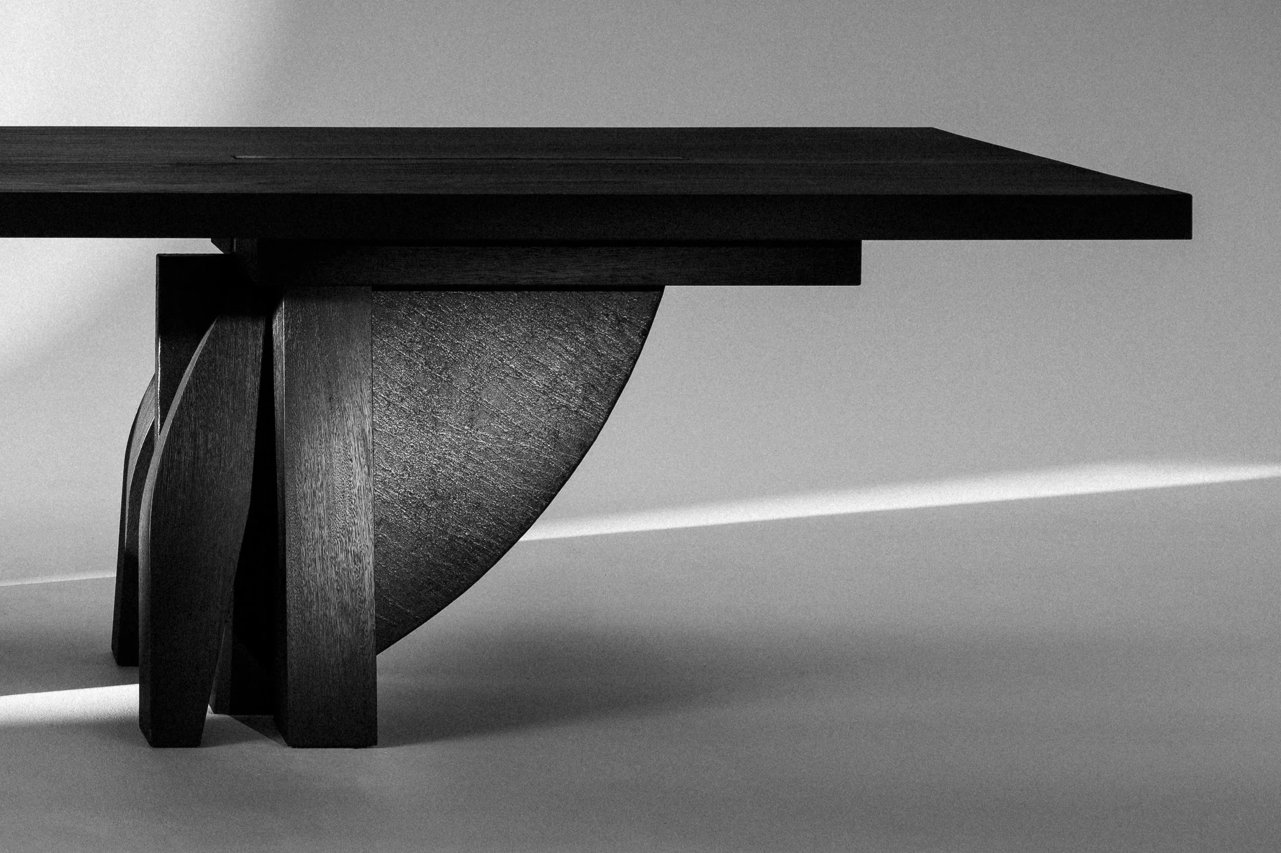 Umbo Dining Table, sculptural base detail — photography by Victor Robyn