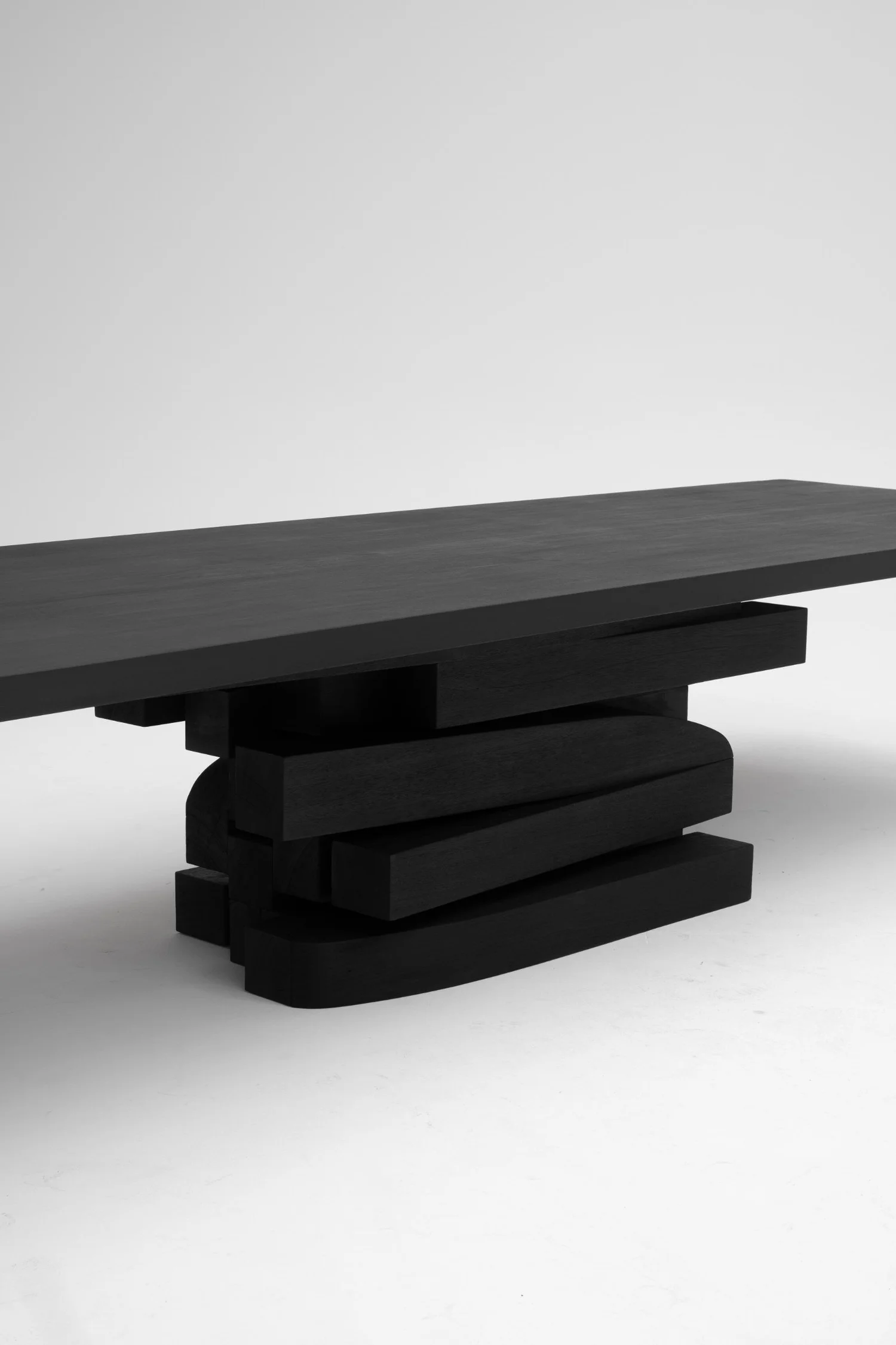 Detail of the burned and oiled Iroko construction of Zoumey Table Horizontal 012024 by Arno Declercq.
