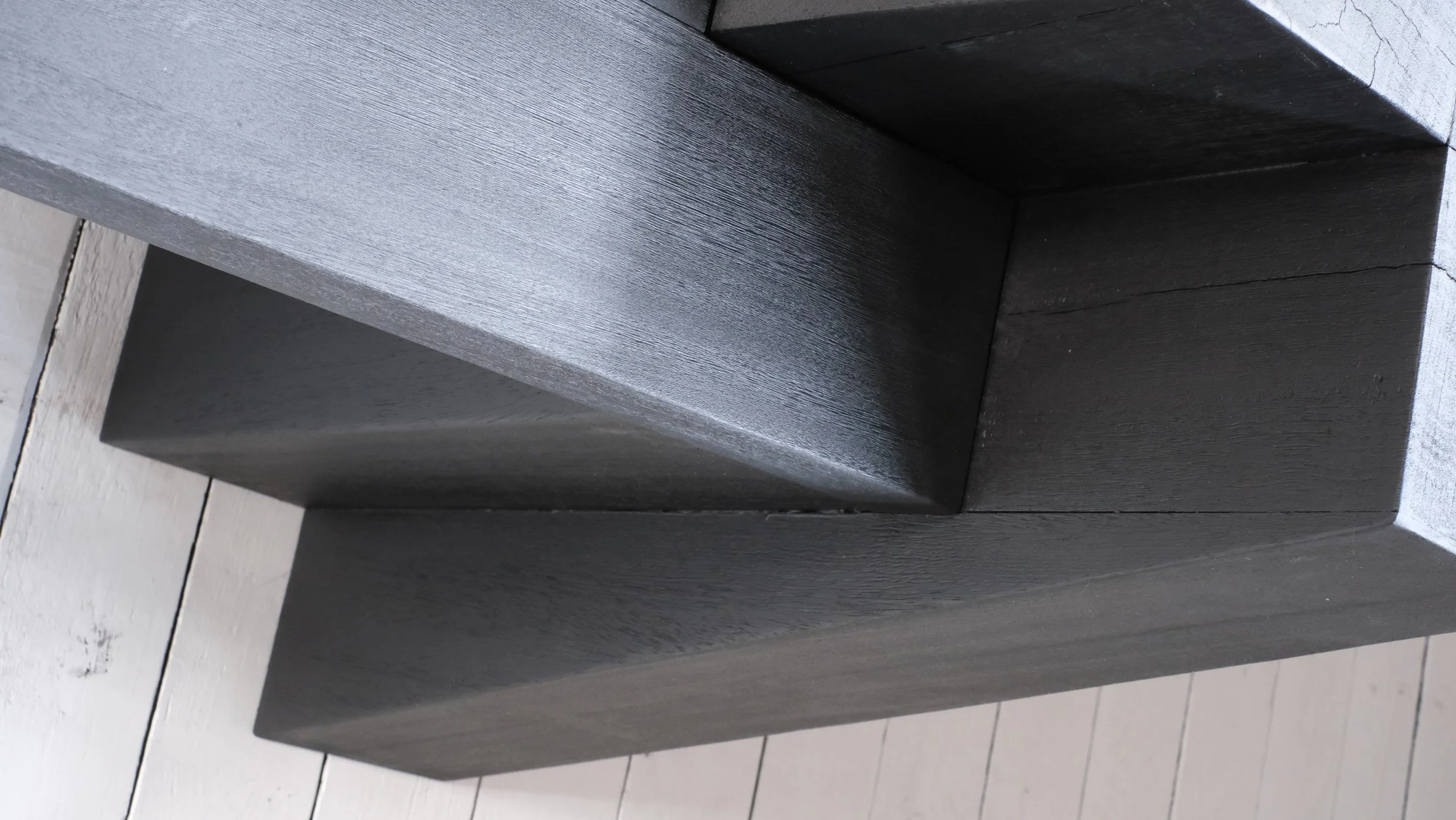 Close-up of the burned and waxed Iroko joint of the AD Bench by Arno Declercq.