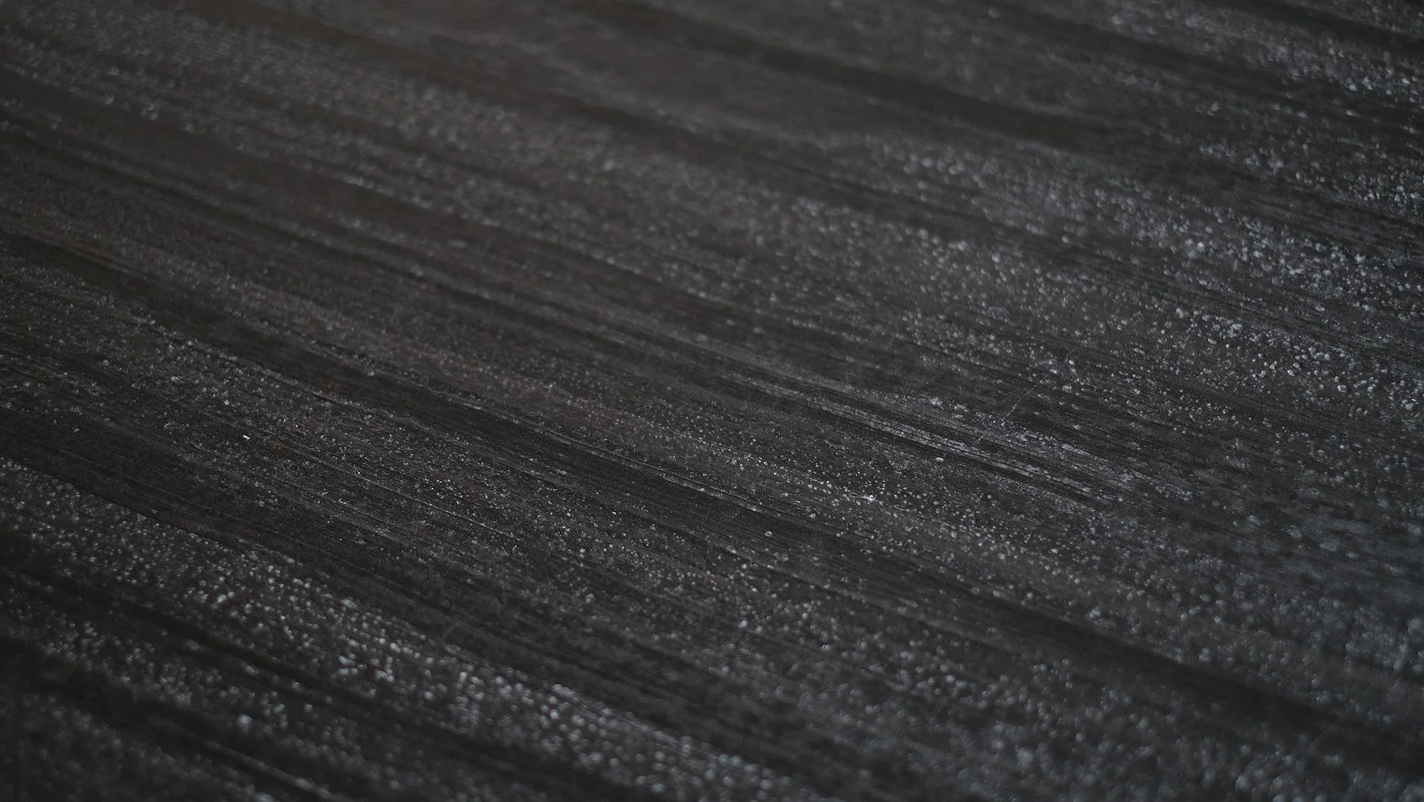 Detail of the patinated metal structure and black marble top of Dining Table 052022 by Arno Declercq.