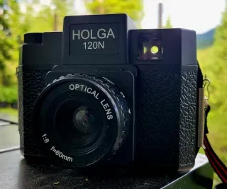 Black Holga 120N film camera photographed outdoors in natural light.