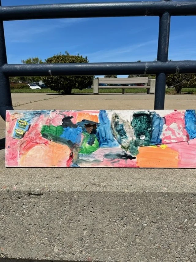 Colorful recycled art made from found beach litter and painted materials