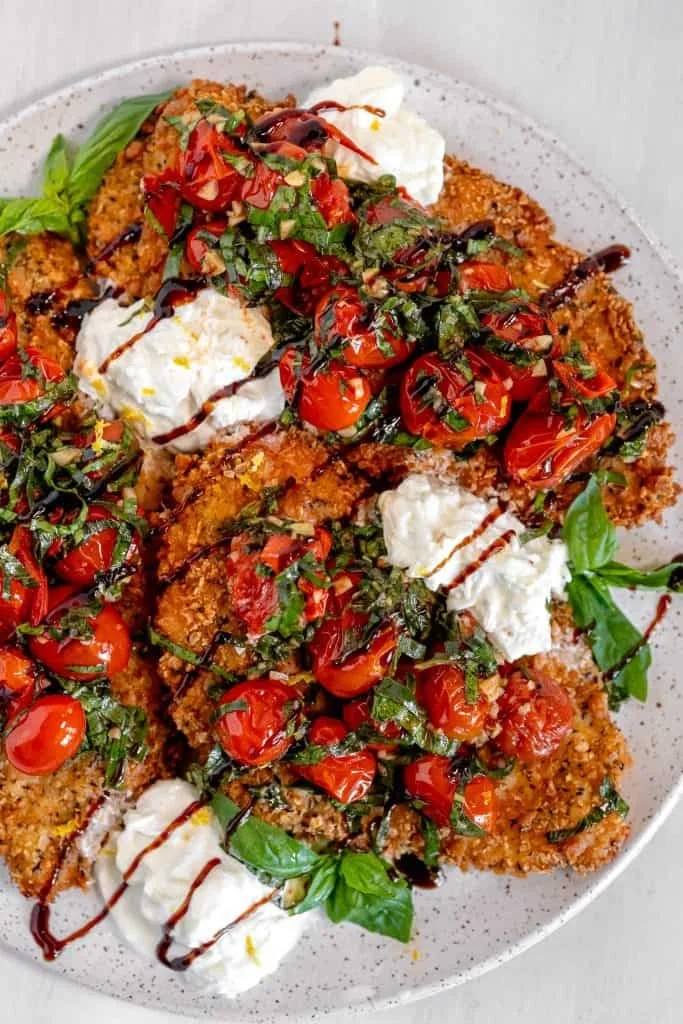 Parmesan encrusted Chicken Cutlet with Burrata and Pesto