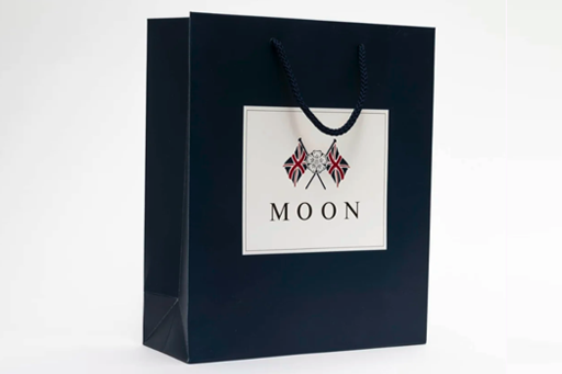 Matt laminated bag with tubular cord handles