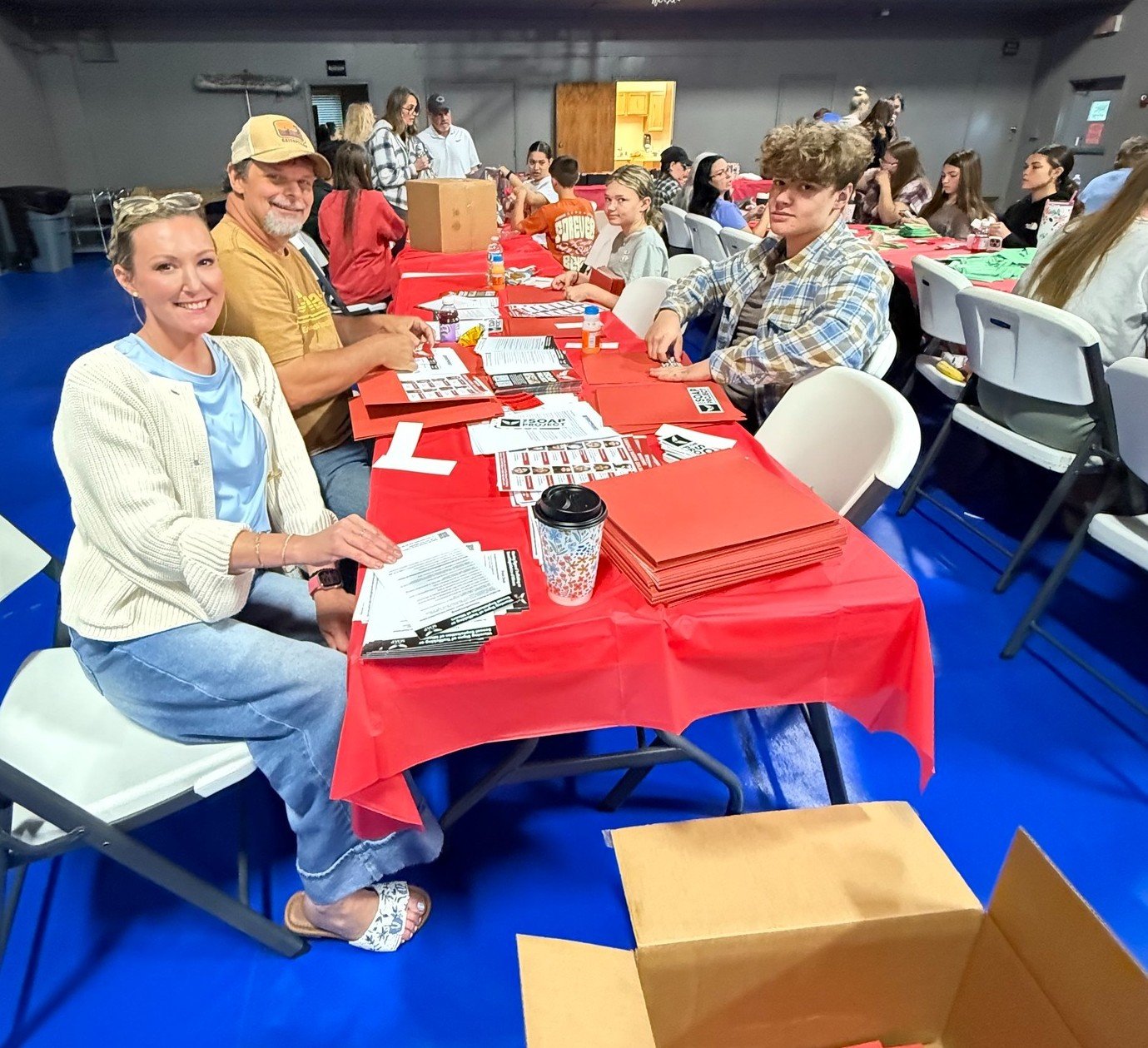 Volunteers preparing SOAP Project outreach materials to distribute human trafficking prevention resources to hotels.