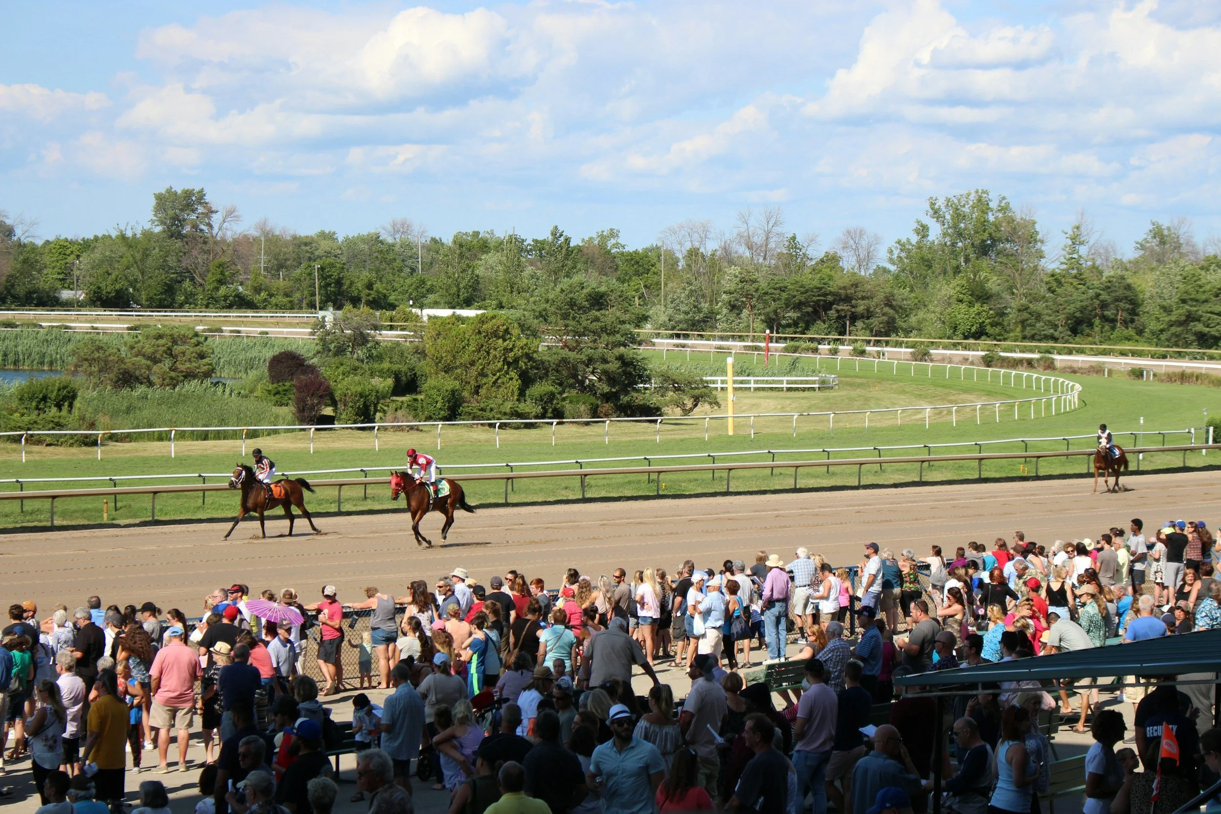 Spectators watch horse races during the Kentucky Derby in Louisville, Kentucky, where The SOAP Project hosted a community human trafficking awareness outreach.
