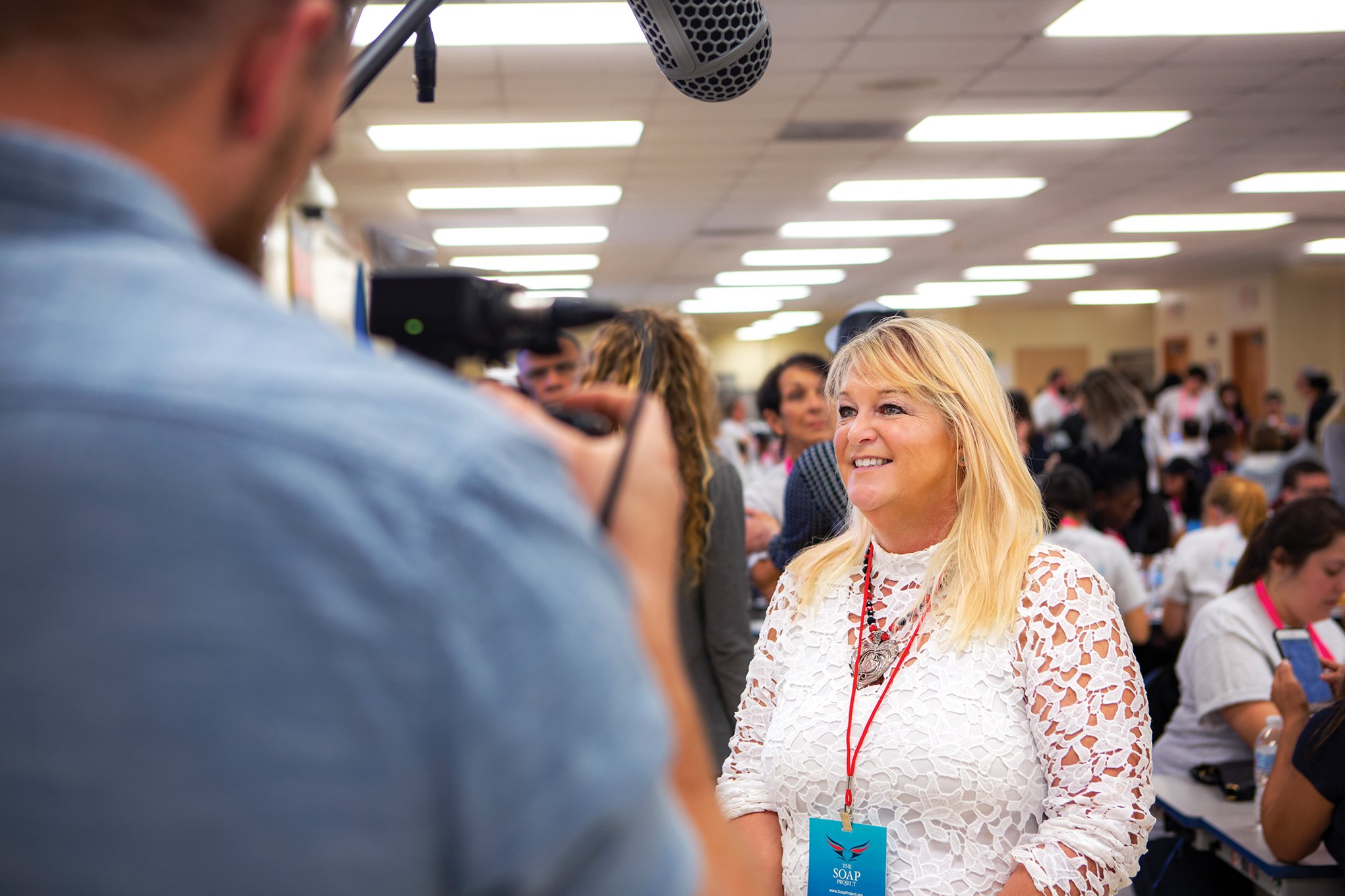 Theresa Flores participates in a media interview while discussing human trafficking awareness and The SOAP Project's mission.
