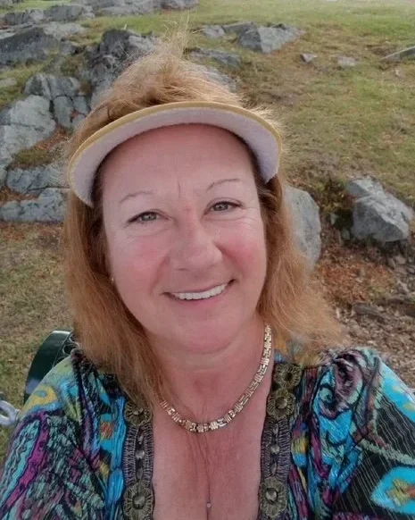Cheri Crider smiling outdoors, whose legacy inspired the SOAP Project Dental Assistance Program.