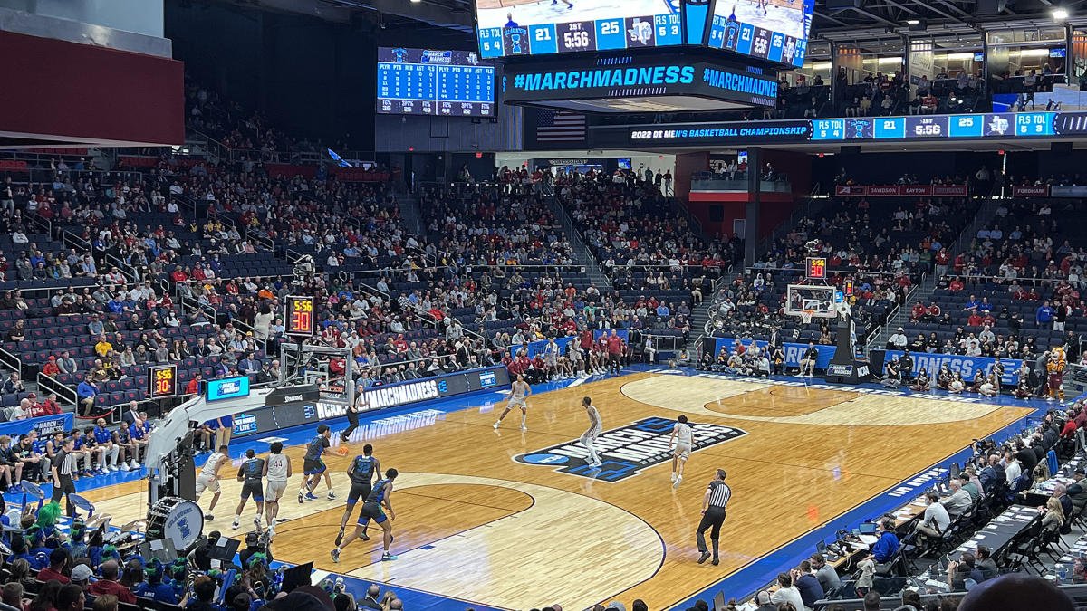 Fans watch an NCAA Men's Basketball First Four game at the University of Dayton Arena, representing The SOAP Project's human trafficking awareness outreach in Dayton, Ohio.