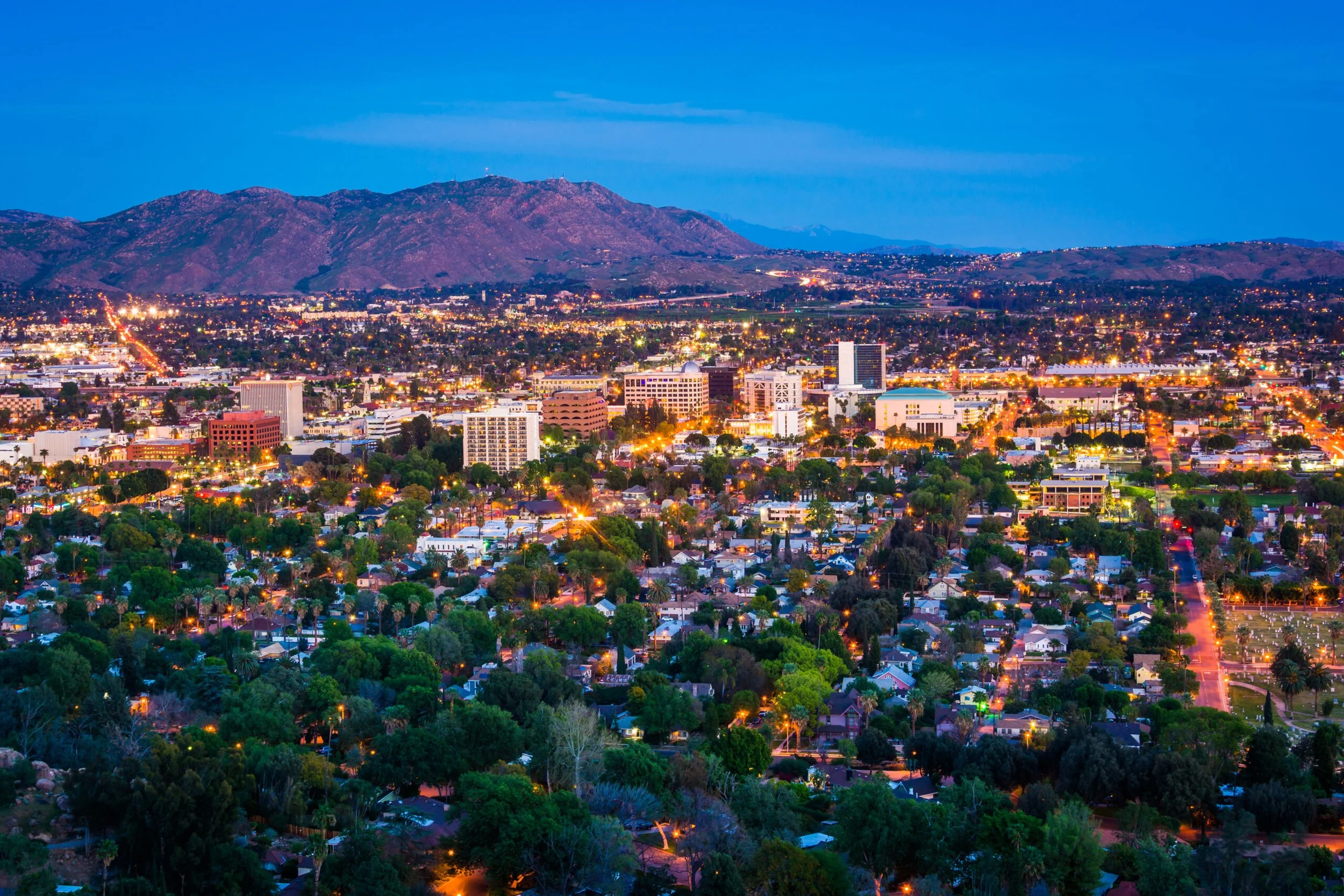 Evening skyline of Riverside, California, representing The SOAP Project and Zonta Club of Riverside human trafficking awareness outreach.
