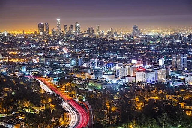 Cityscape of Burbank, California, with the Los Angeles skyline in the background, representing The SOAP Project outreach in Burbank.