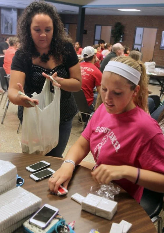 Volunteers labeling hotel soaps during a SOAP Project human trafficking awareness outreach event.