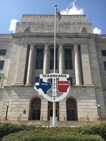 State Line Post Office and Texas–Arkansas state line monument in Texarkana, representing The SOAP Project's human trafficking awareness outreach in Texarkana, Arkansas.