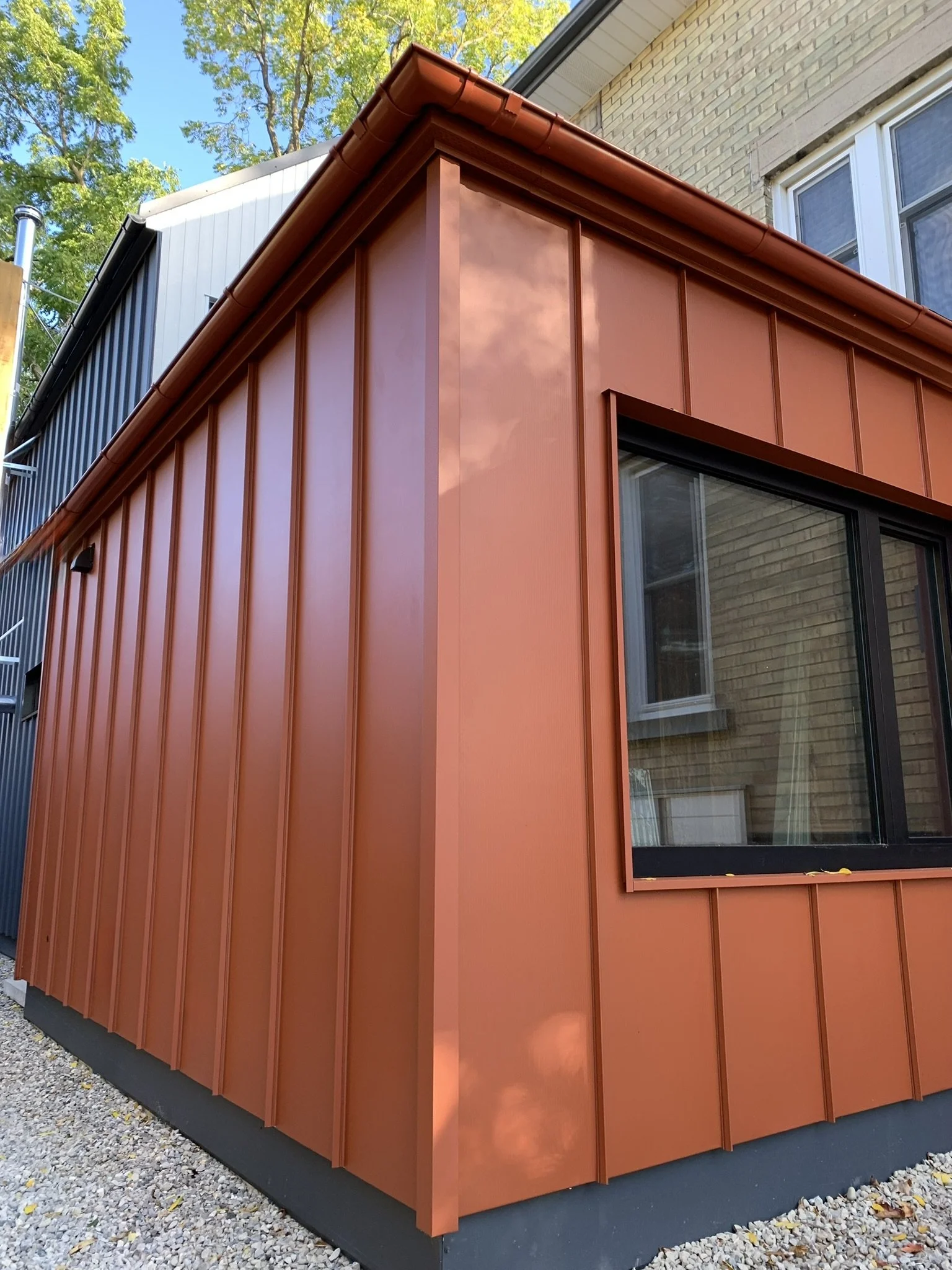 Hinterhaus 41 by Elevïn Design Studio featuring a rust standing seam steel façade and half-round eaves by Finnish manufacturer Ruukki, Photo by Brad and Shawn Hernden