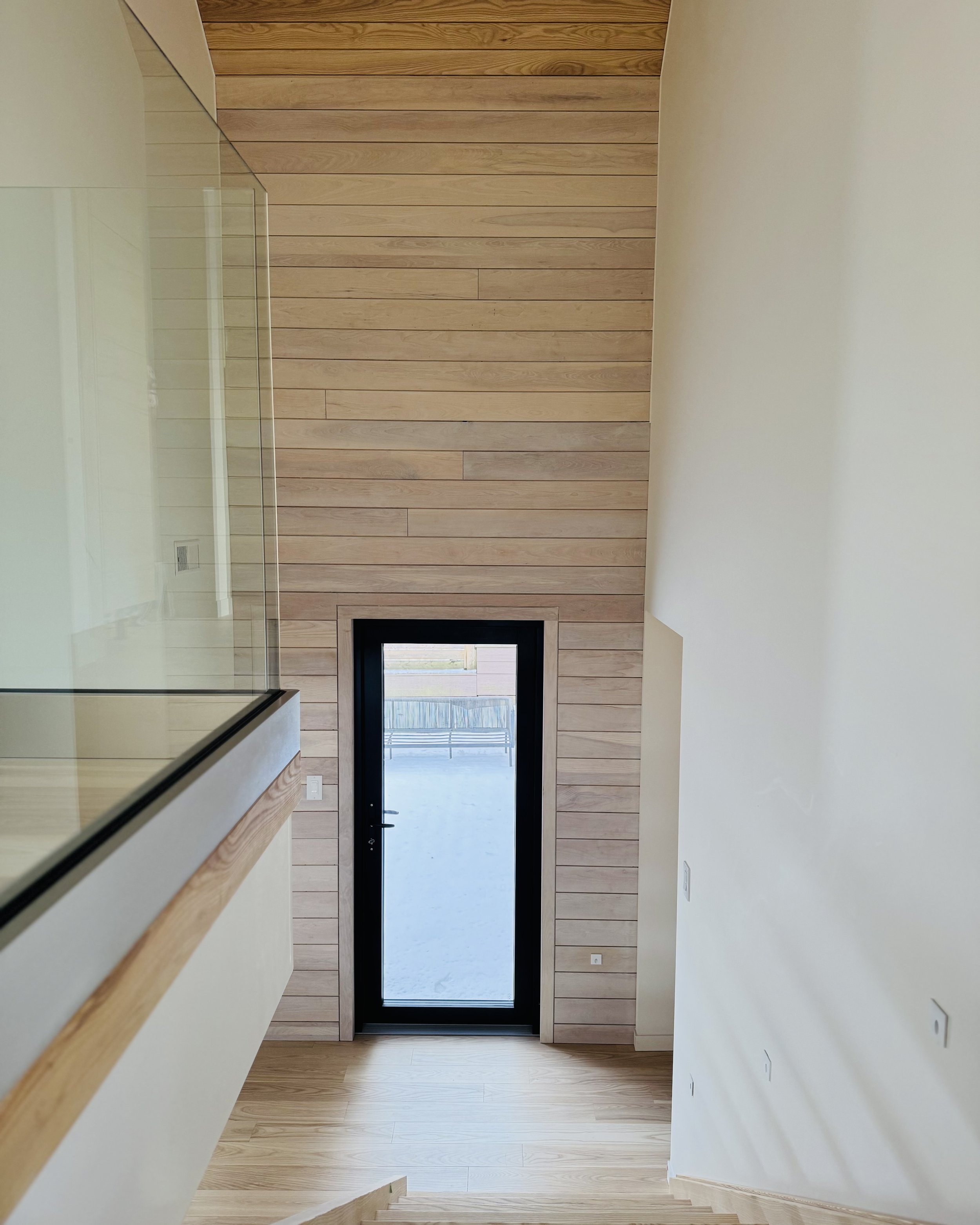 HH31-hinterhaus-41-nordic-barn-adu-elevin-design-group-vetta-glazed-ebony-door-canadian-ash-cladding-tongue-and-groove.jpg