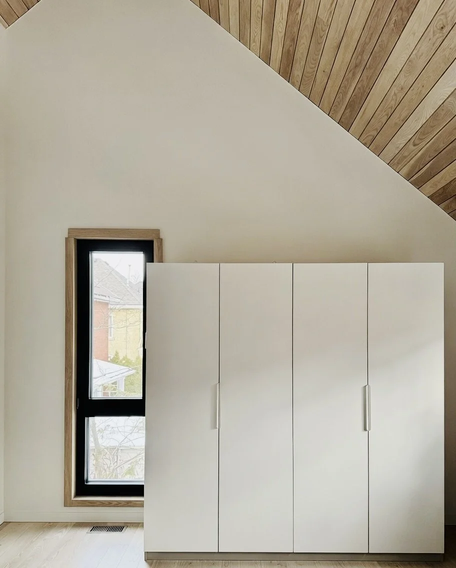 IKEA PAX closets installed at Hinterhaus 41 by Elevin Design Studio, featuring modular storage solutions, modern Scandinavian interior design, photo by Brad and Shawn Hernden