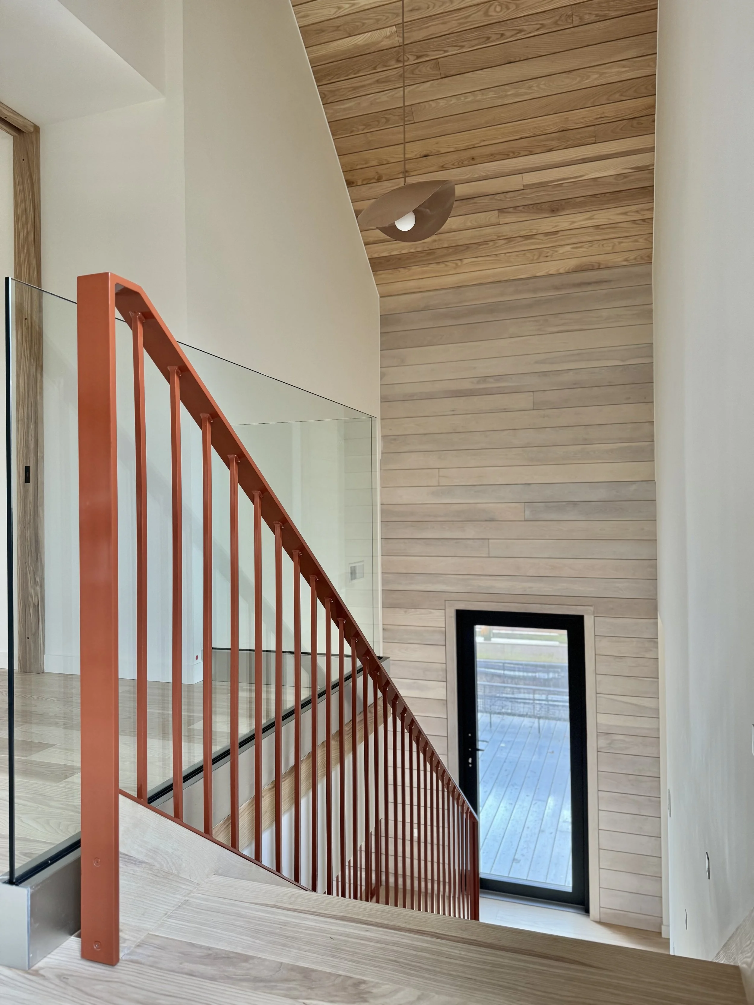 HH50-hinterhaus-41-stratford-ontario-open-stair-risers-rust-iron-railings-nordic-interiors-scandinavian-accessory-dwelling-unit-black-passive-construction-doors-vetta.jpeg