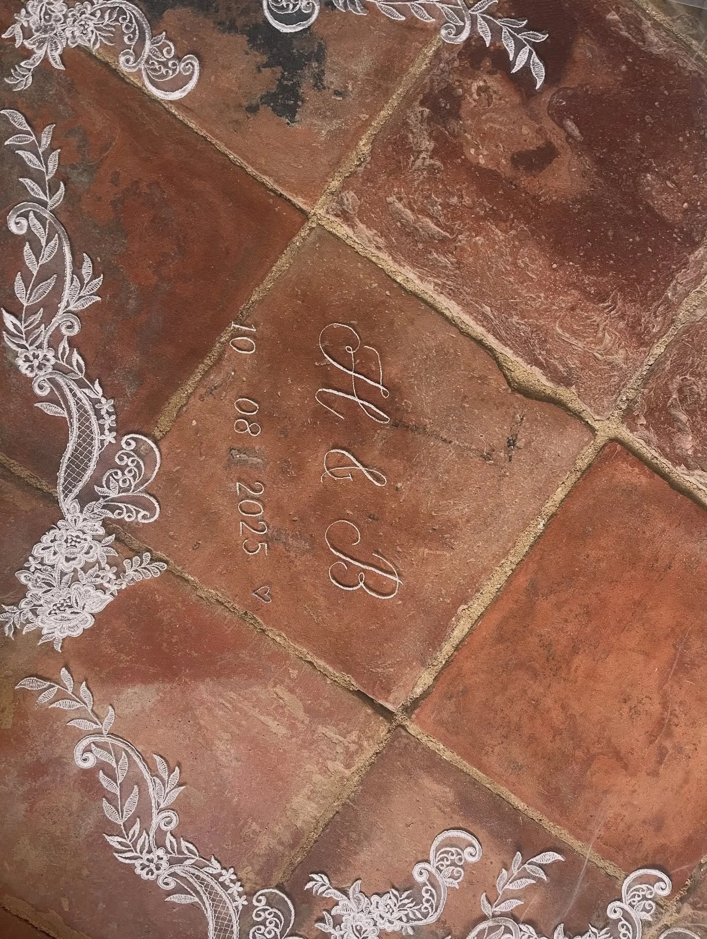 Hollies beautiful wedding veil! This custom monogram fit perfectly within the dips of lace. We selected a gorgeous modern script for the monogram, and embroidered in a matching bright white shade, paired with a simple blue heart. 

#weddingmonogram