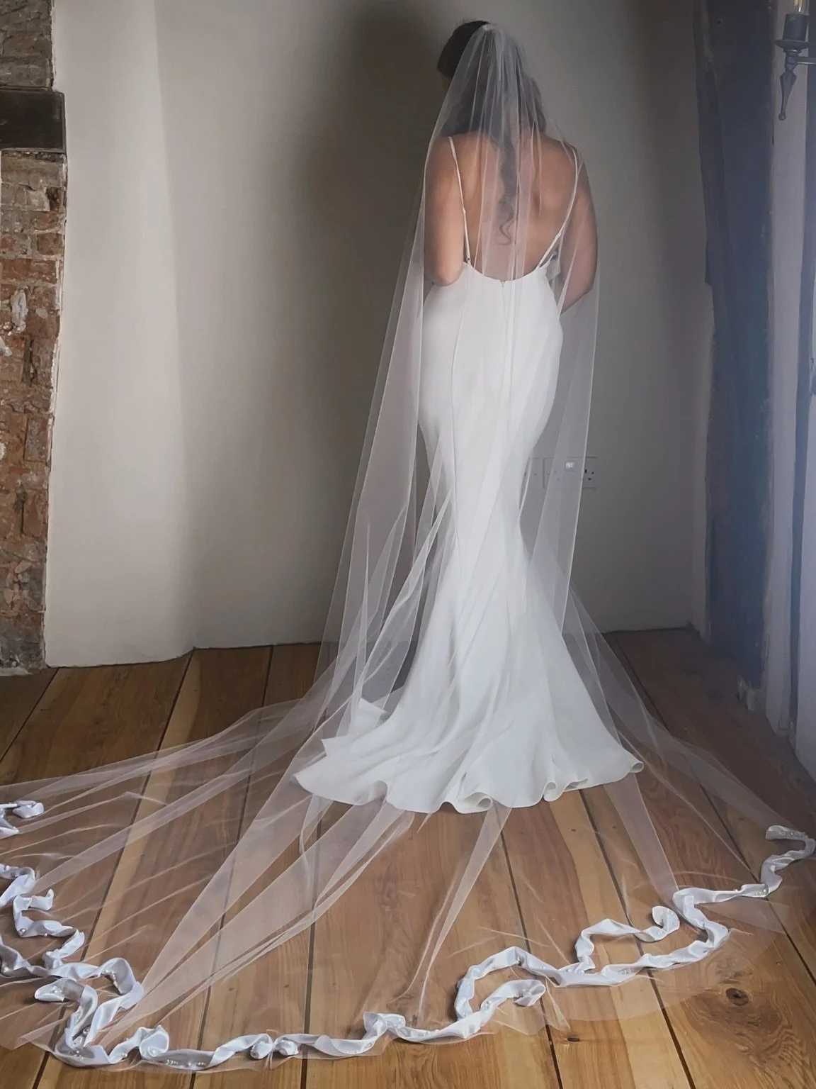 Silk and Pearls - January 2026 
This incredible veil features over 5 meters of hand curled and stitched ribboned, flowing with over 660 pearls onto a chapel length veil. 

We hand make only 12 of these veils each year. 

And it is customisable. 

Des