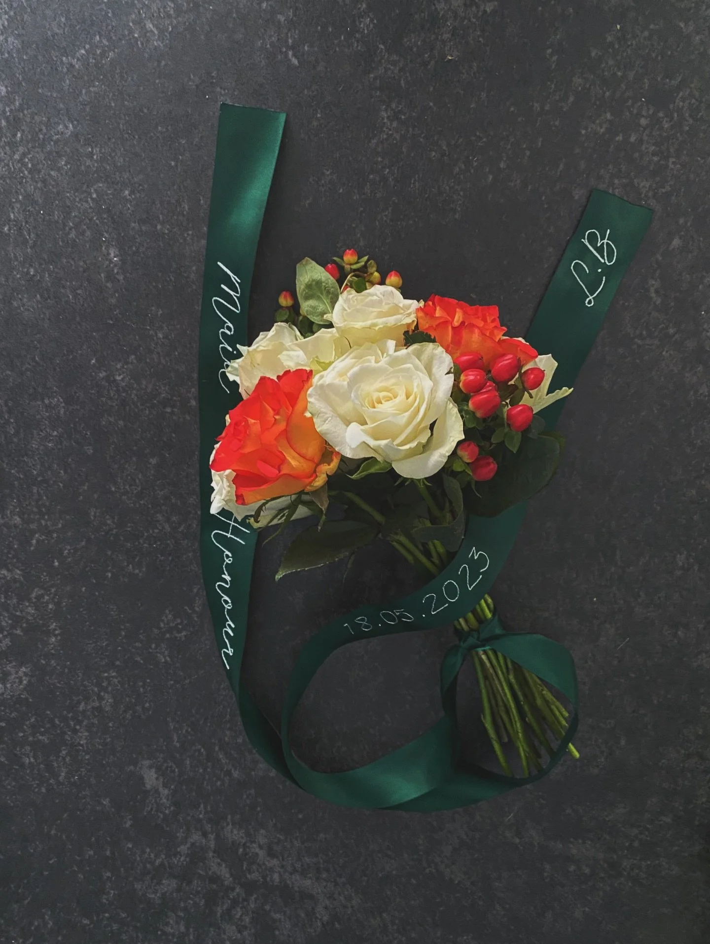 Part of our first core collection, the maid of honour ribbon, is still one of my favourites. In a gorgeous deep green, with a bright white thread, this ribbons suits the fiery orange roses perfectly. 

#maidofhonour #weddingmonogram