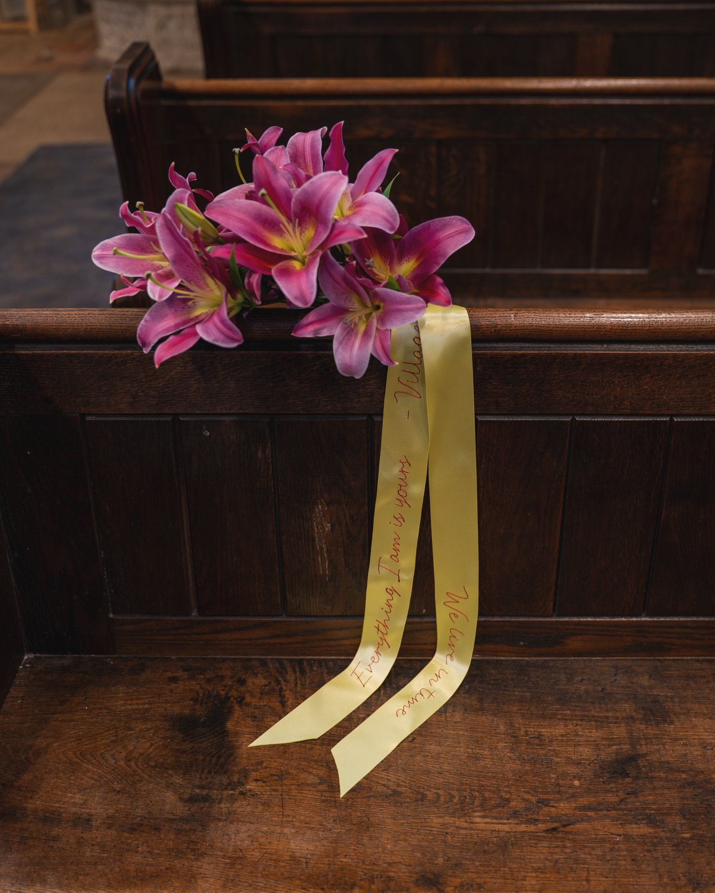 Everything I am is yours - The Villagers 
Hand embroidered lyrics into bouquet ribbons are very popular at the moment. We chose a vibrant yellow and scarlet for this design that paired perfectly with the Lillies. 
What is your wedding song? 

Photogr