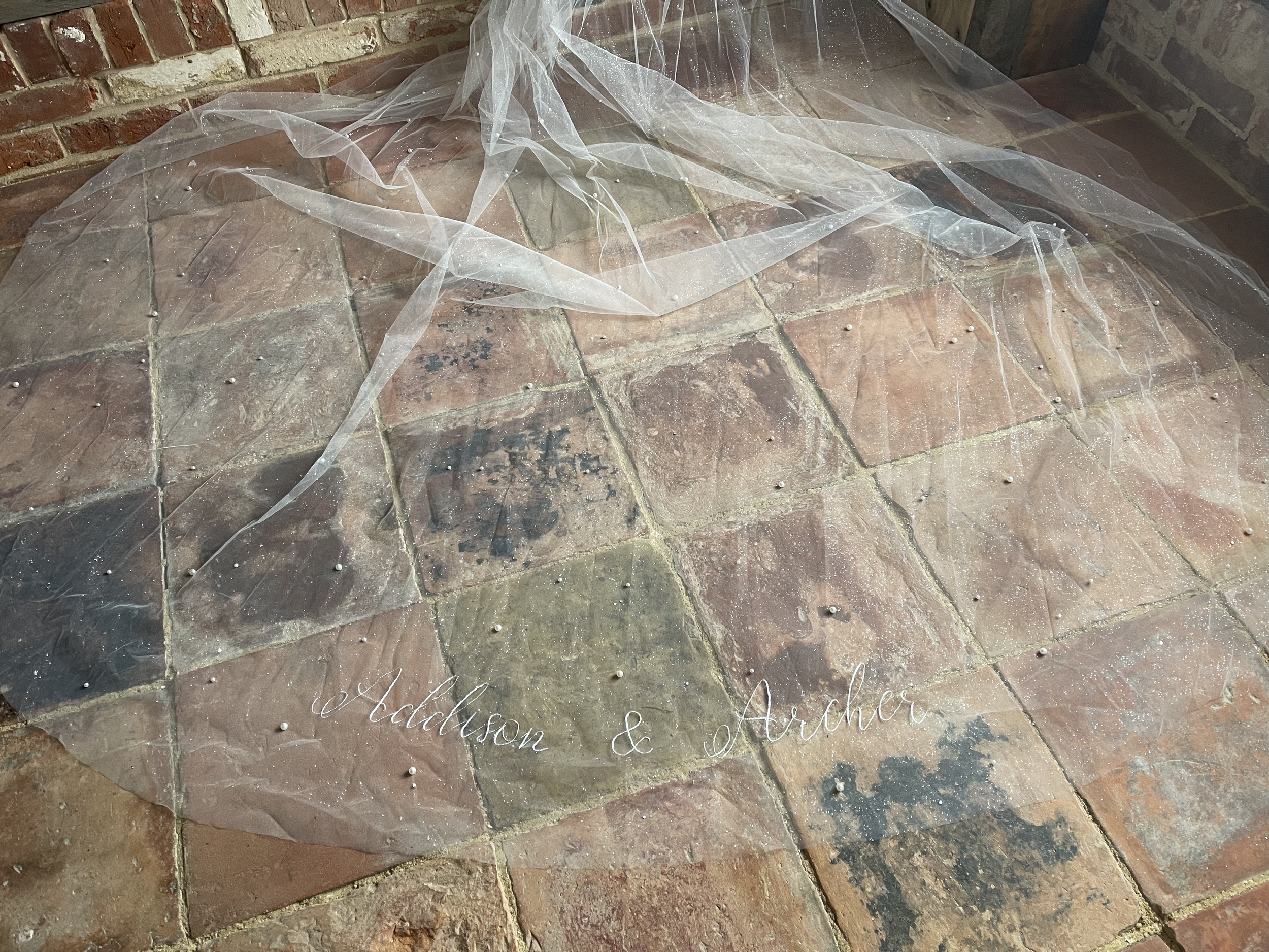 Handmade wedding details UK, embroidered something blue, luxury wedding embroidery UK, embroidered wedding ribbon with quote
, custom veil embroidery with initials, embroidered wedding date ribbon, custom colour embroidery wedding accessories
, embro