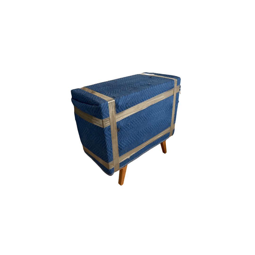 Furniture wrapped in moving blankets for a move