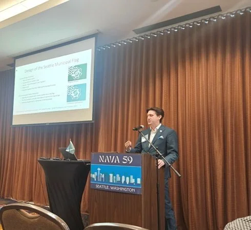 Photo of a presenter discussing the Seattle City Flag at NAVA 59