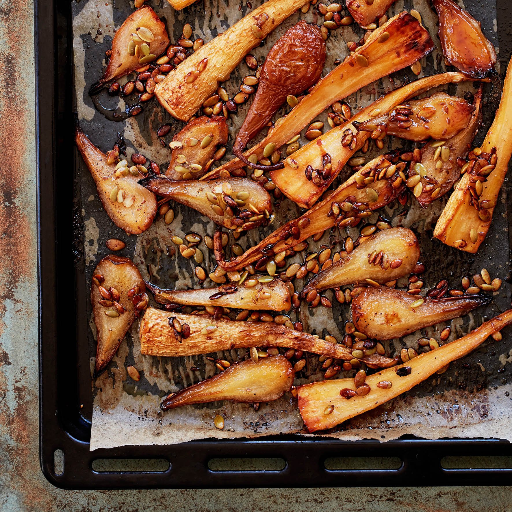 Lucy's Honey-roasted Pears and Parsnips were probably one of the only times during our photographing of HOMECOOKED that we stood around and munched our way through the entirety of what we had just shot 😆. The tray of sticky, sweet, yet also sharply 