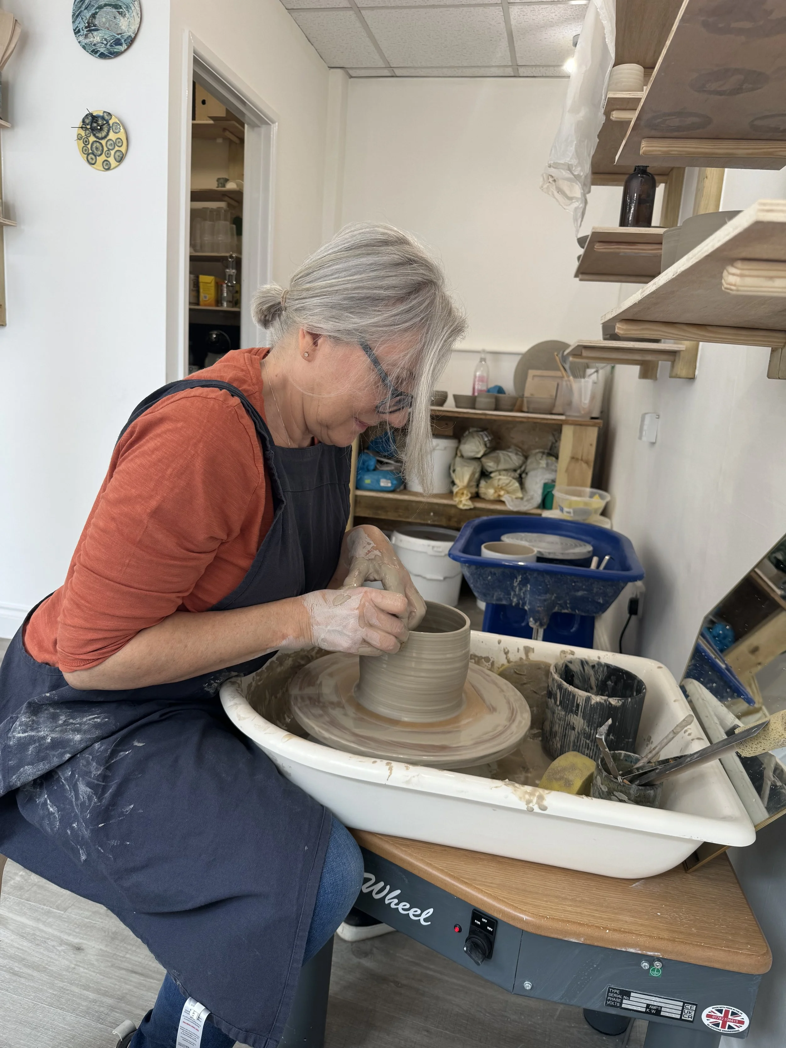 Private pottery lesson (one person) Student receiving one-on-one guidance on the pottery wheel during a private lesson at Clod Pots.