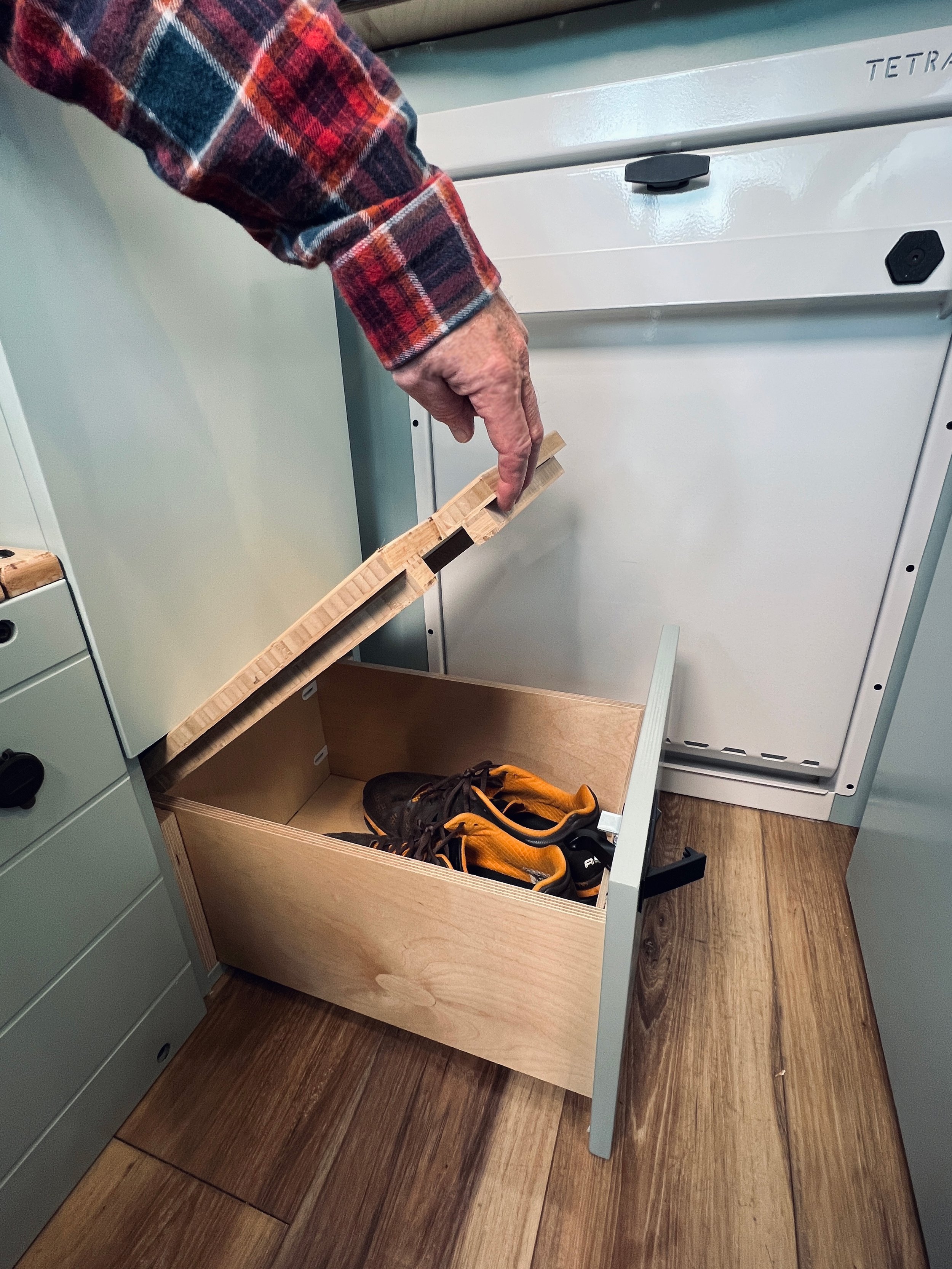 Drawer step to bed doubles as more storage.