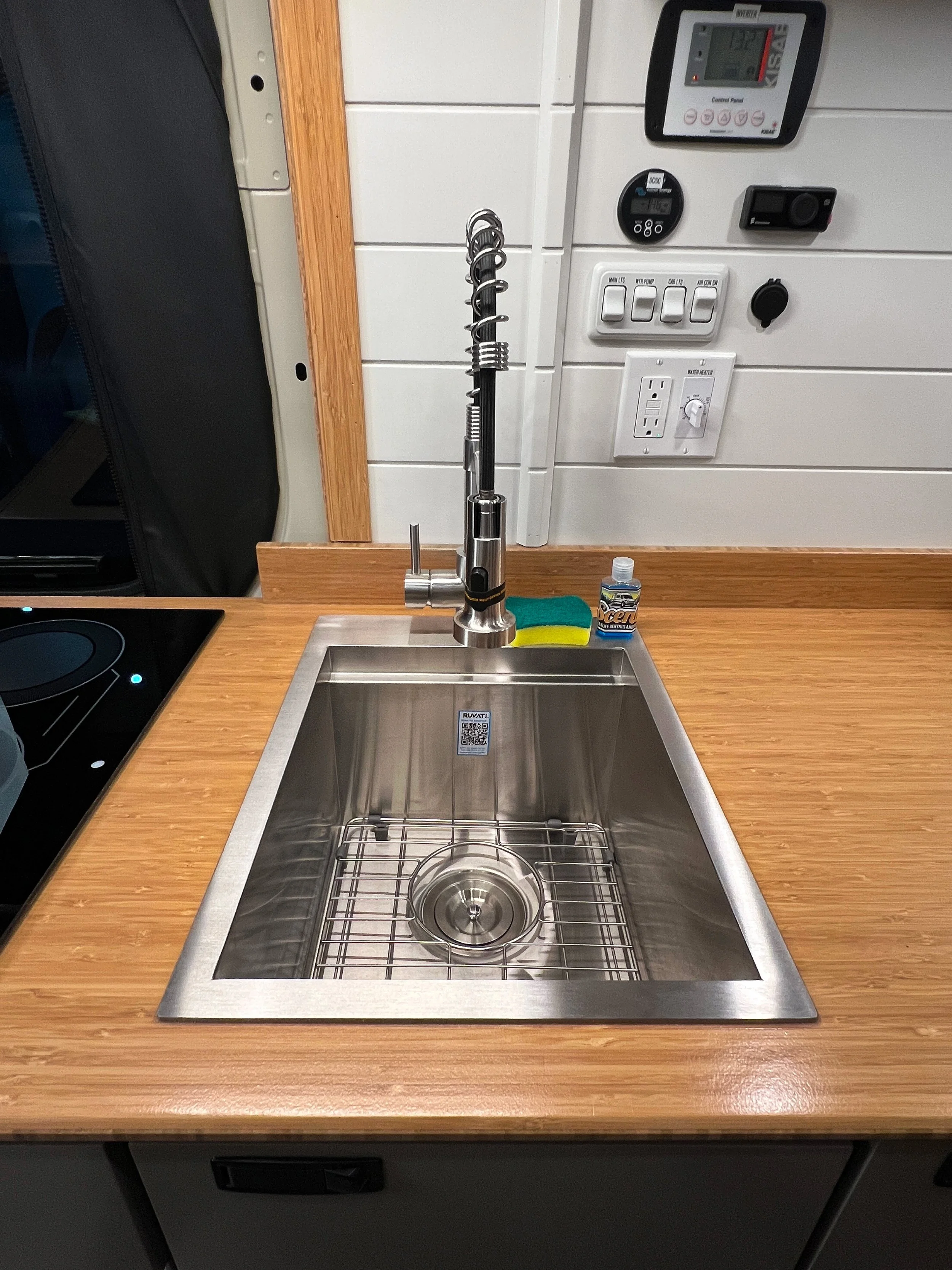 The large, deep sink provides hot and cold water so you can conveniently do your dishes as if you were at home.