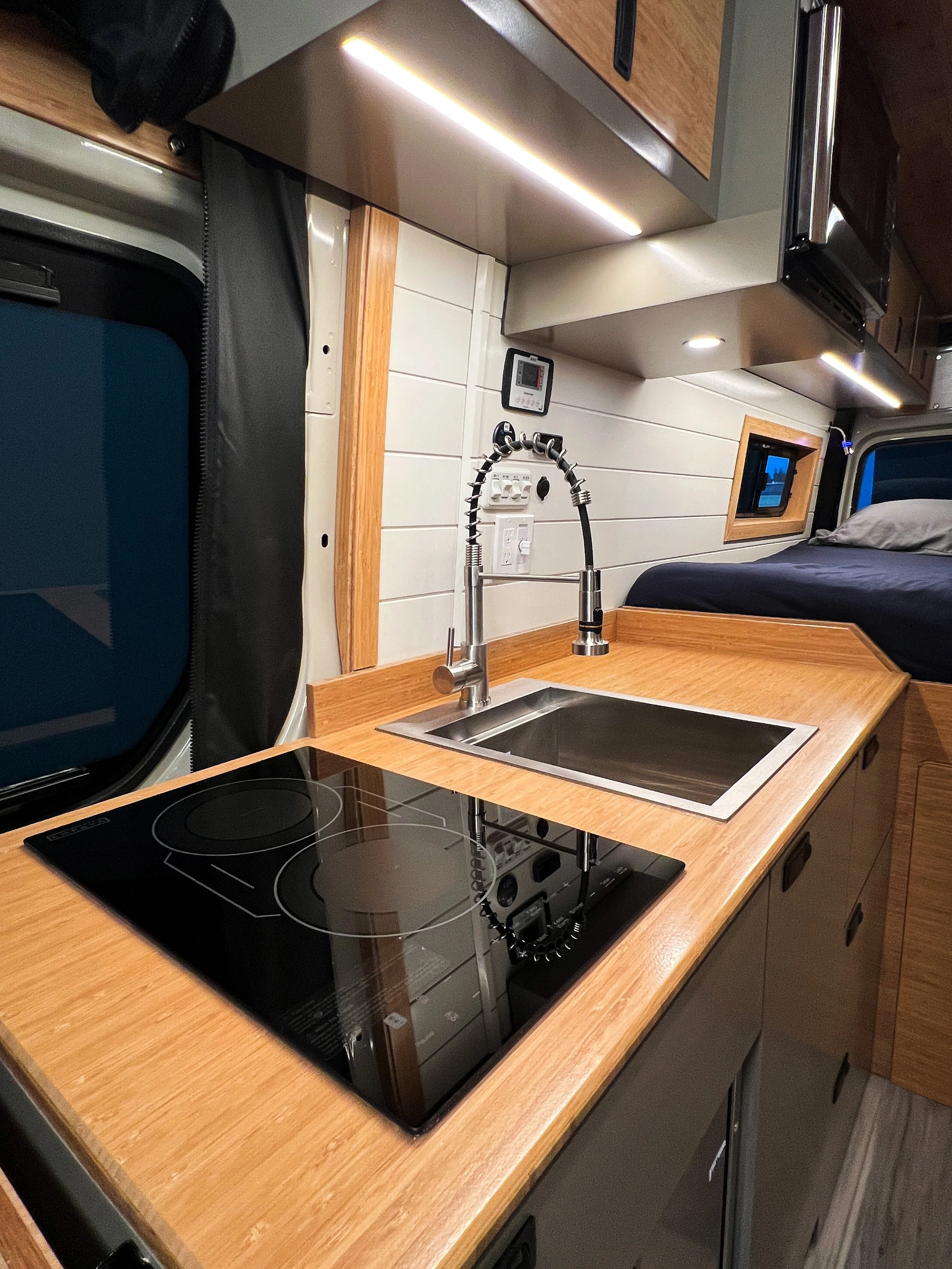 The two-burner induction cooktop allows you to cook plenty of meals on the go.
