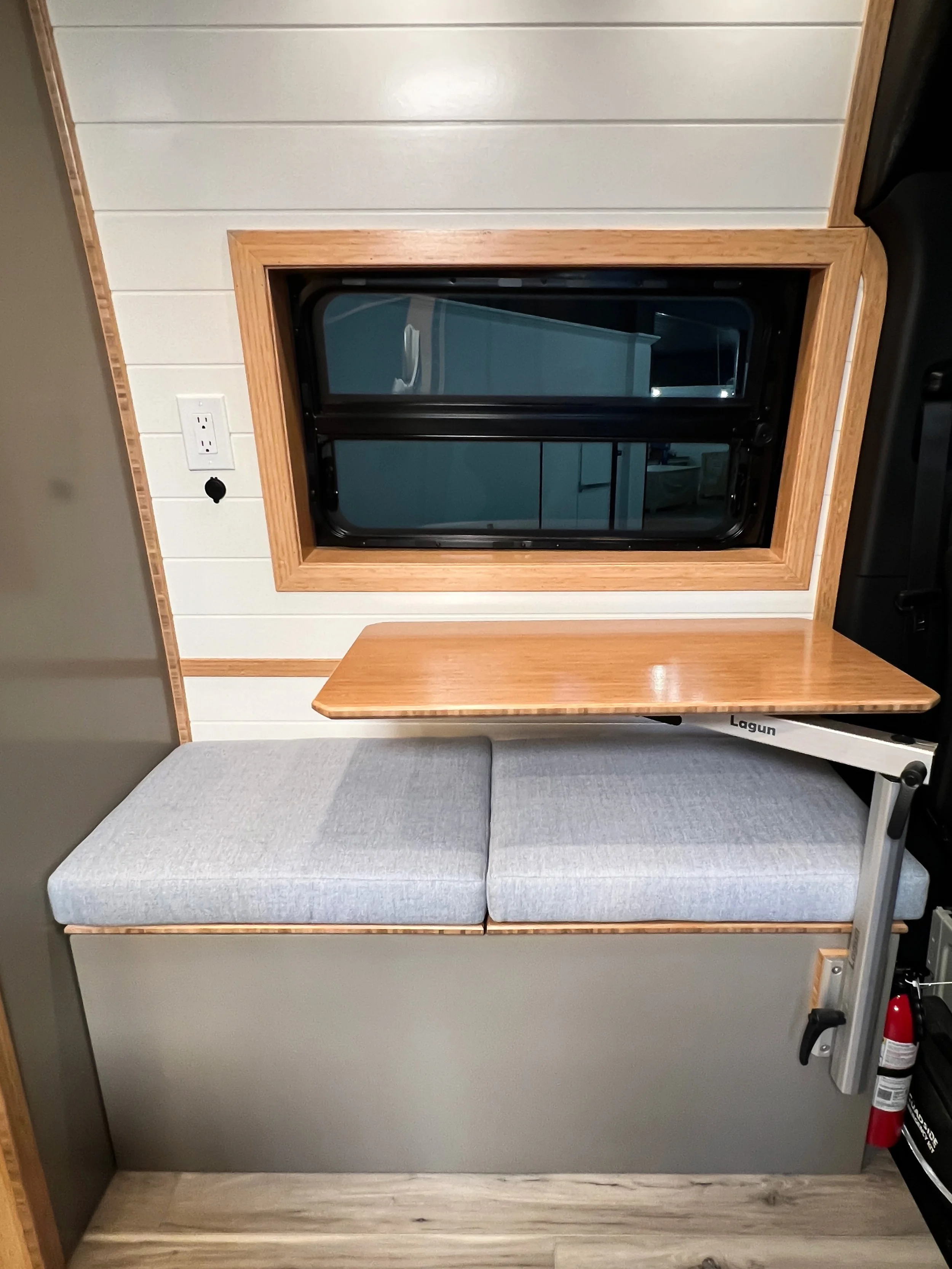 The two-person bench provides a comfortable space to rest, while looking out the crew window or out the open sliding door.