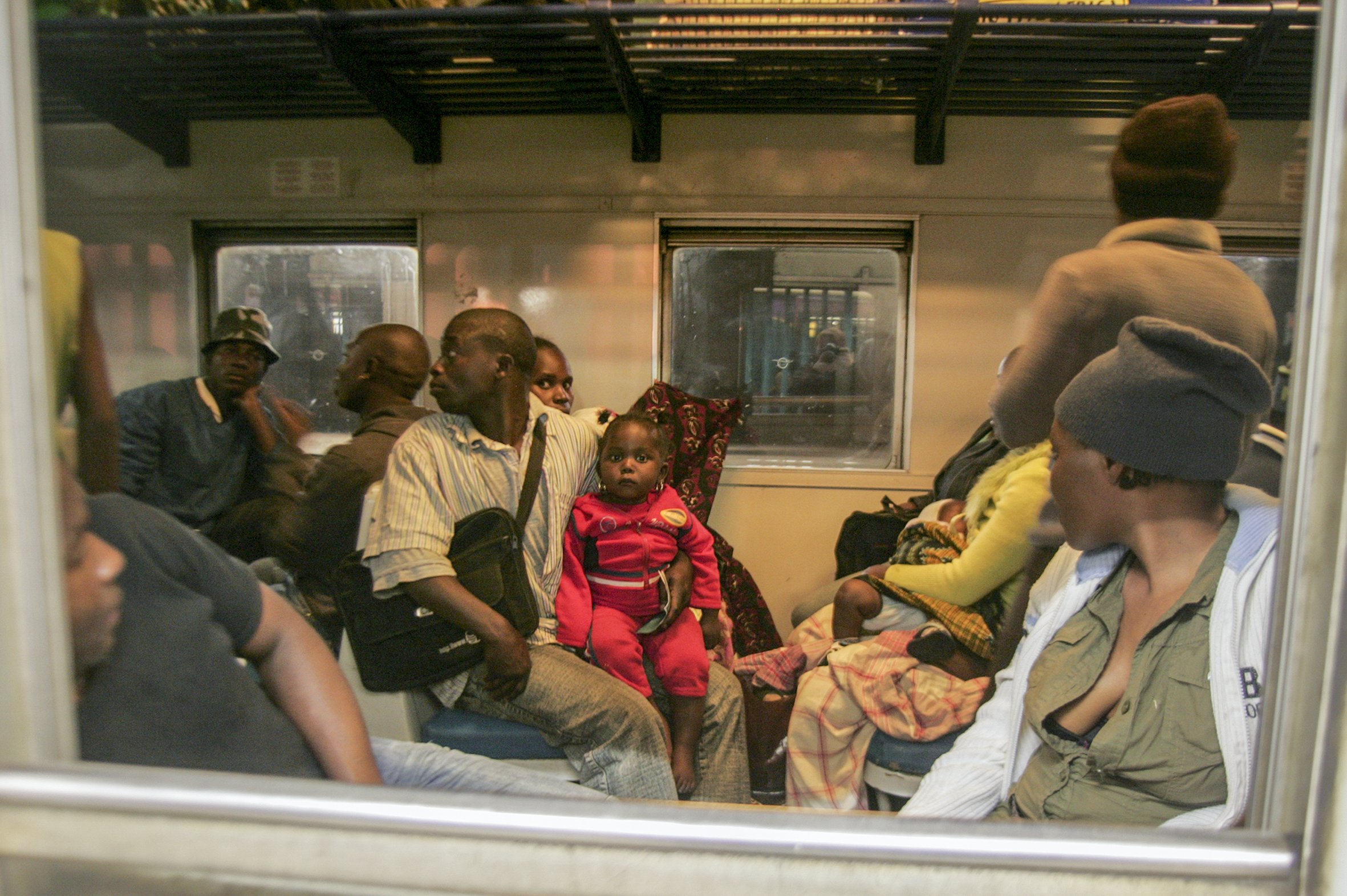 The Ngwenya family board the Komatiepoort train on their journey back Maputo after fleeing the destruction of their home during clashes between foreigners and locals in Ramophosa township, east of Johannesburg, South Africa.