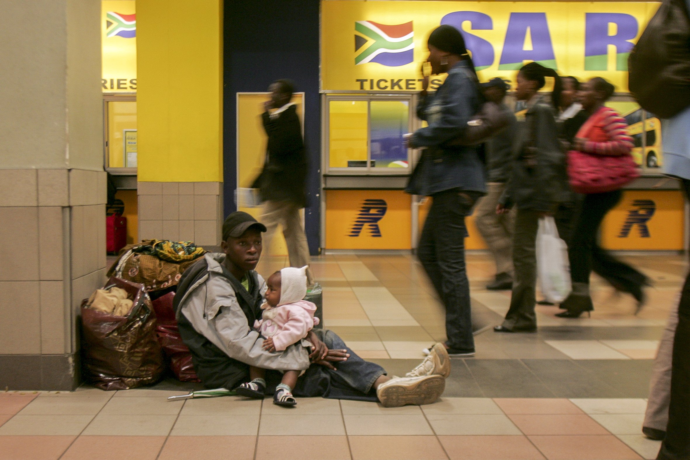 Mawra Ngwenya waits at Park Station for her uncle to return with train tickets to Komatiepoort as they flee back to Maputo, Mozambique. Their home was destroyed in clashes between foreigners and locals in Ramophosa township, east of Johannesburg, So